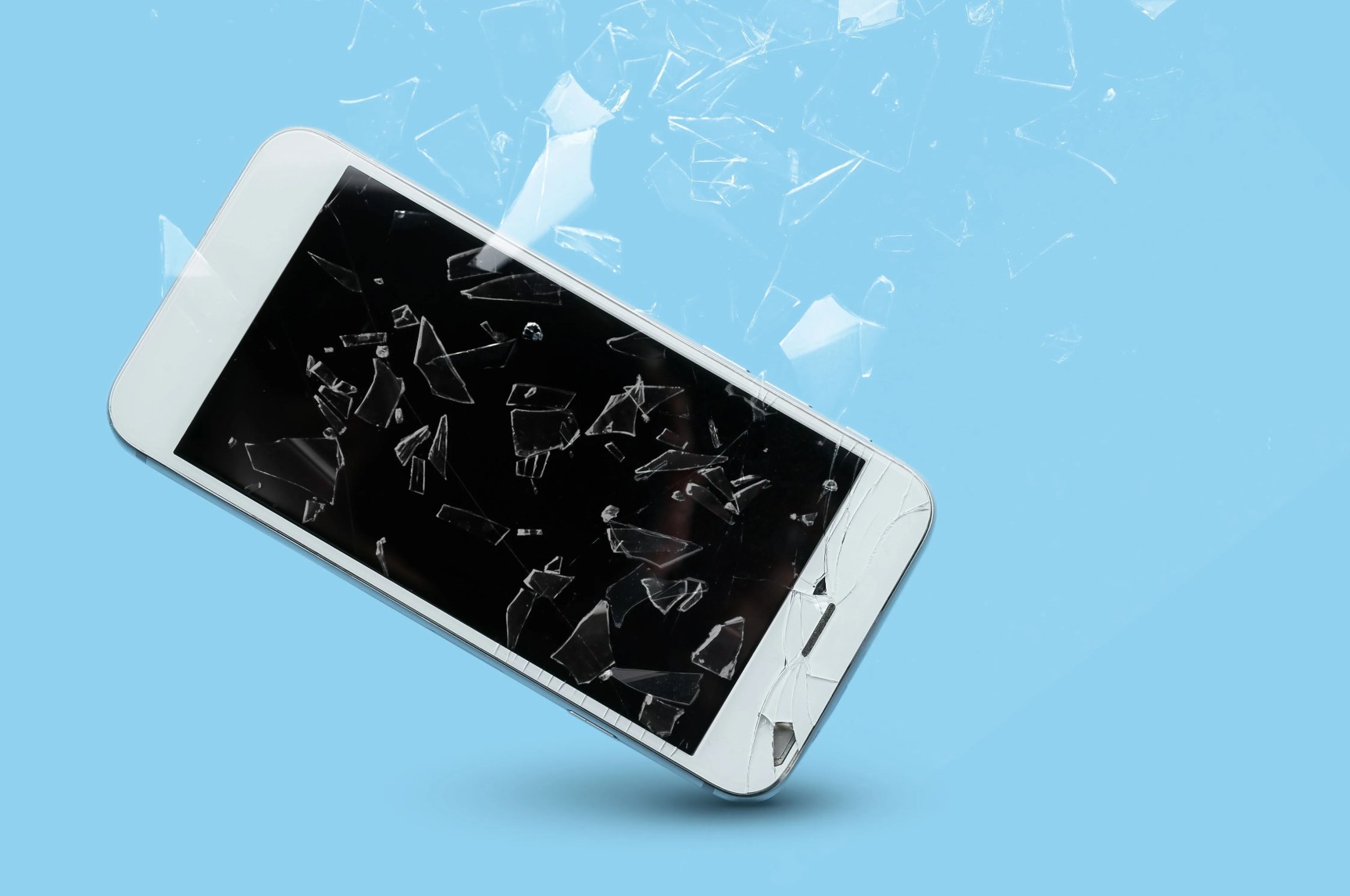 mobile phone with cracked glass screen on color background