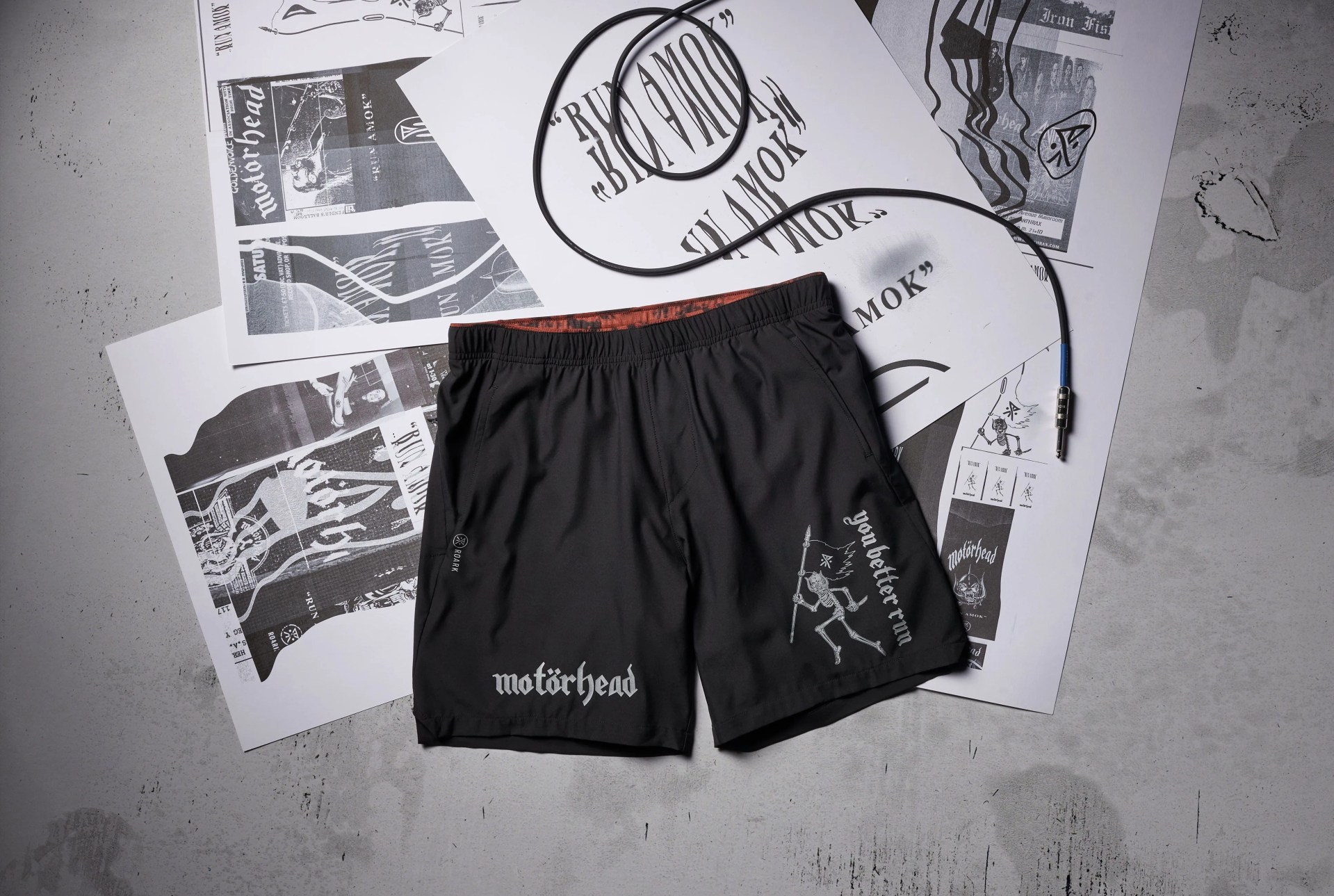 roark shorts laying against print outs