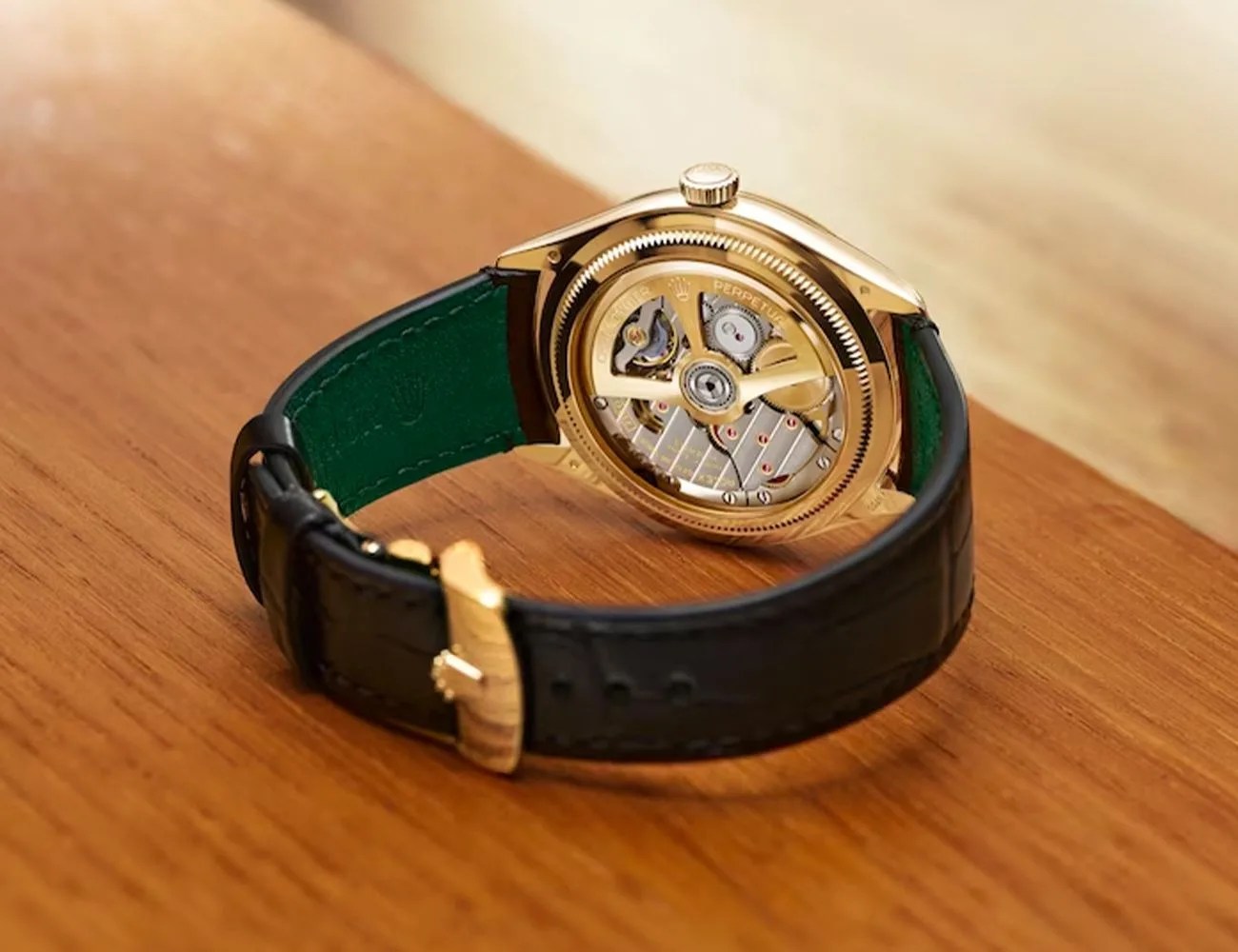 a rolex watch on a table