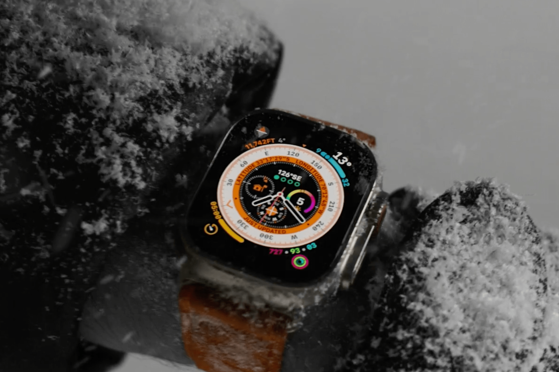 apple watch ultra on wrist with snow