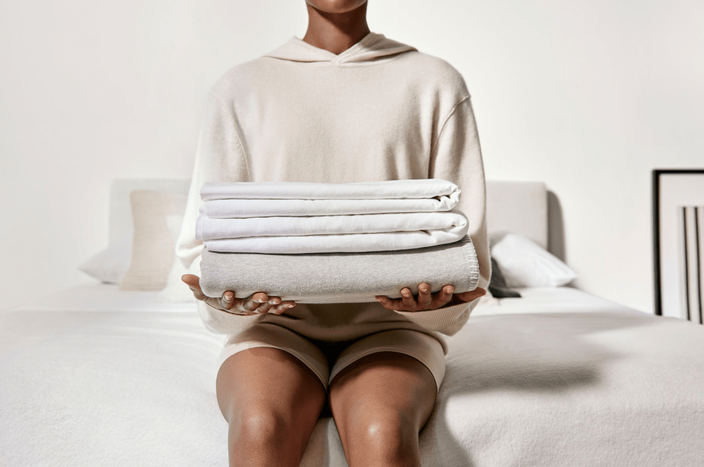 person holding stack of sheets
