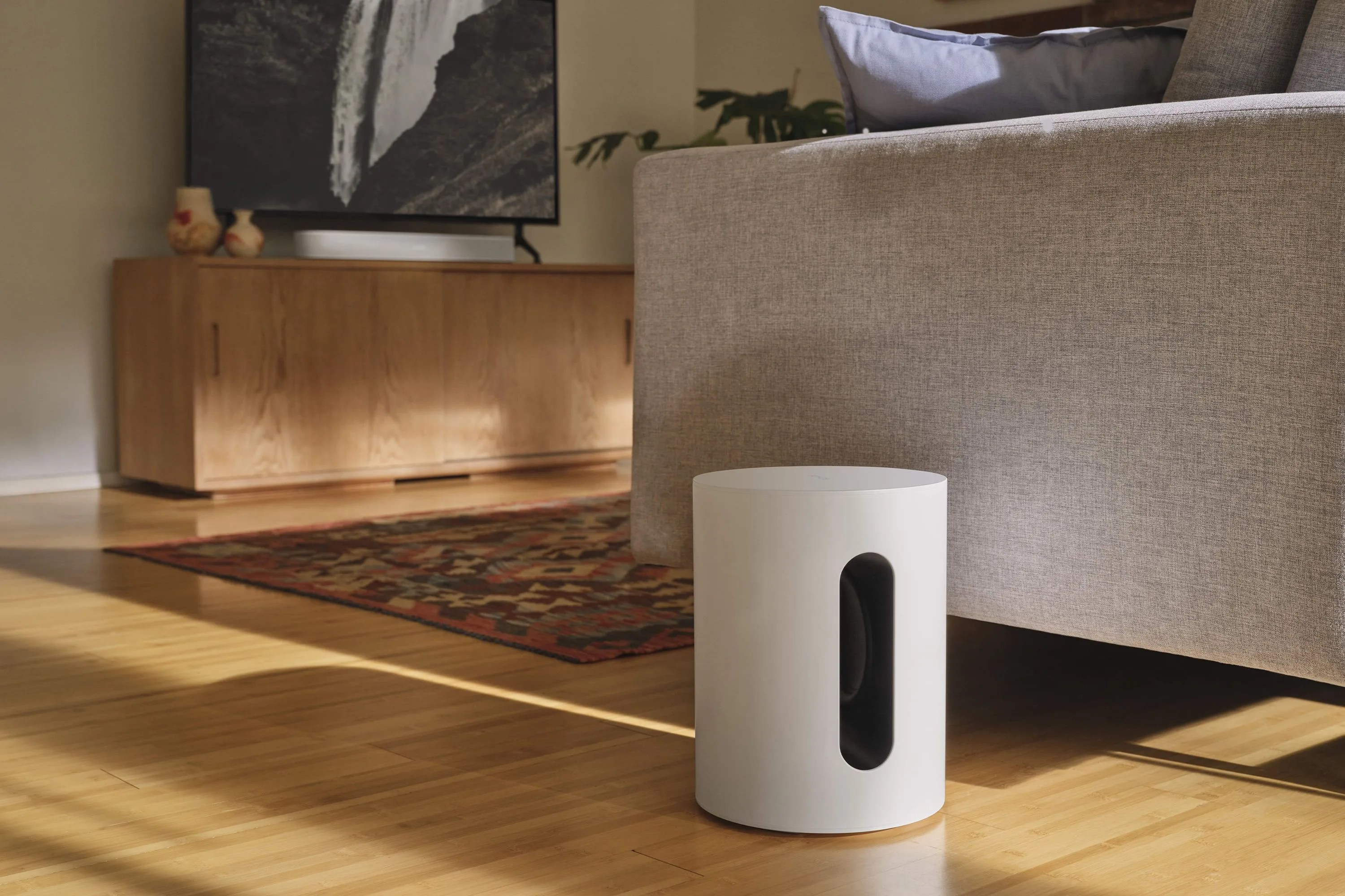 sonos sub mini on a living room floor
