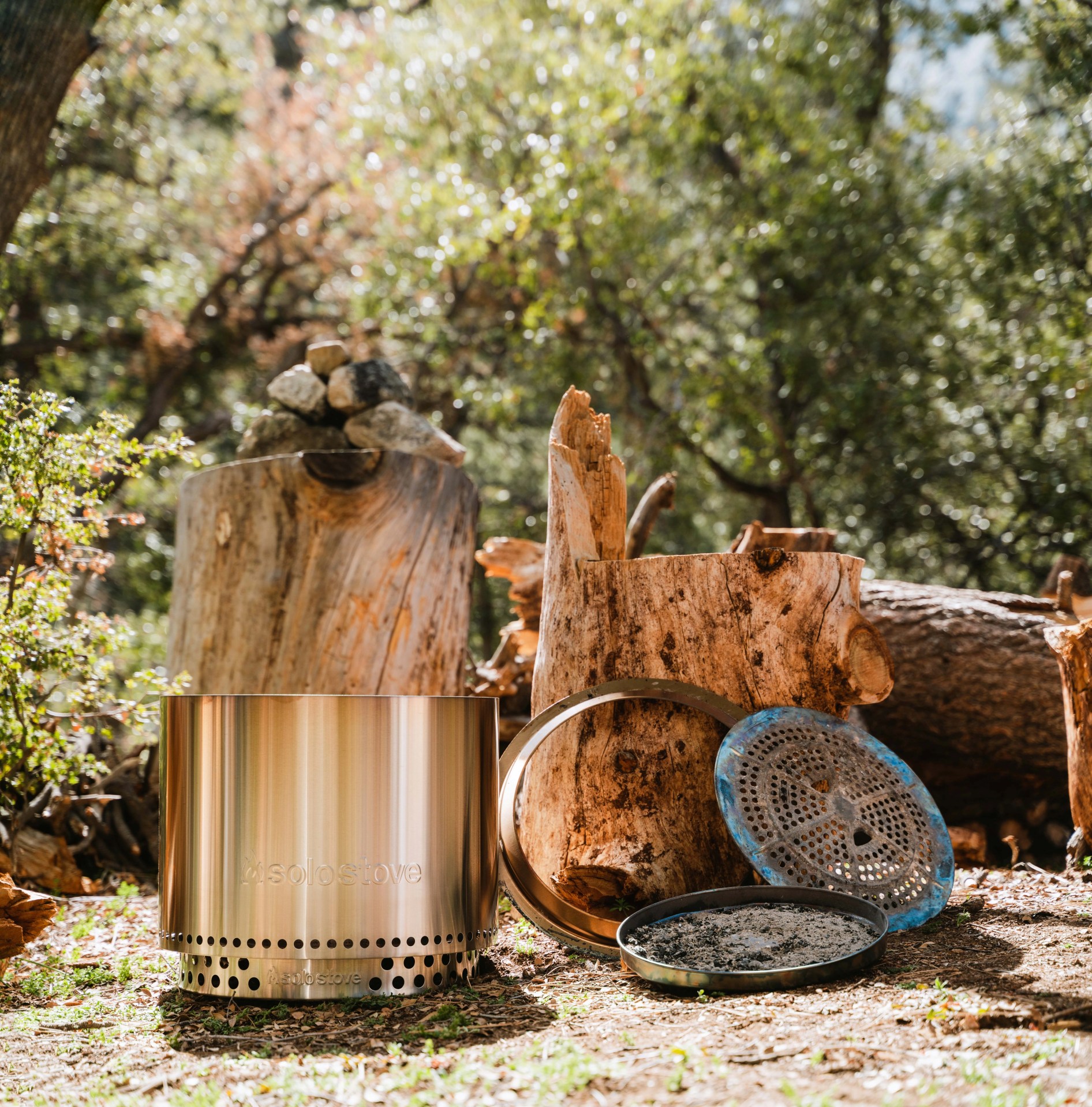 solo stove fire pit with parts at a camp site