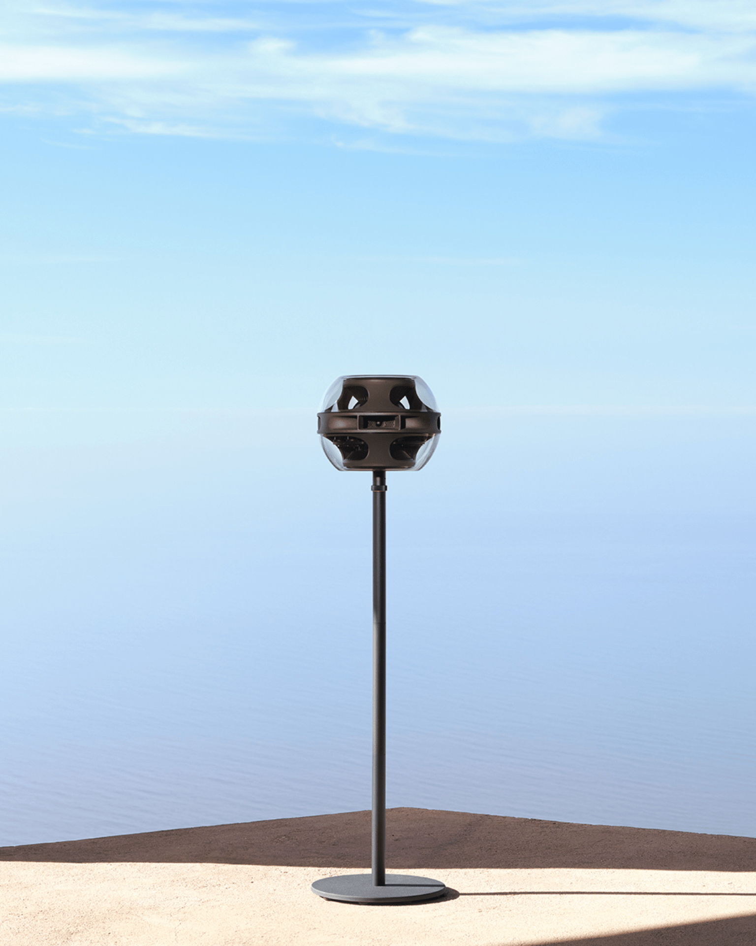 a syng cell alpha with floor stand in black