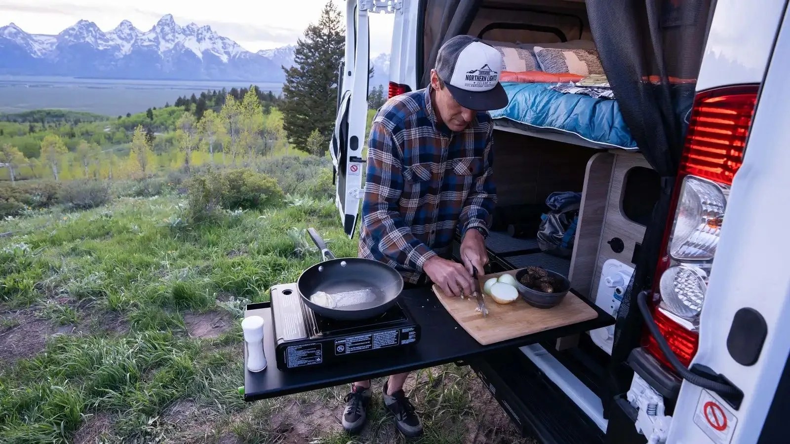 winnebago solis npf camper van with cooking surface extended out from rear
