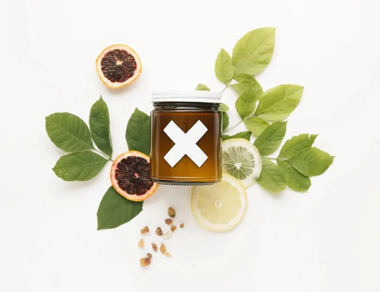 wax buffalo candle on top of leaves and dried orange and lemon slices