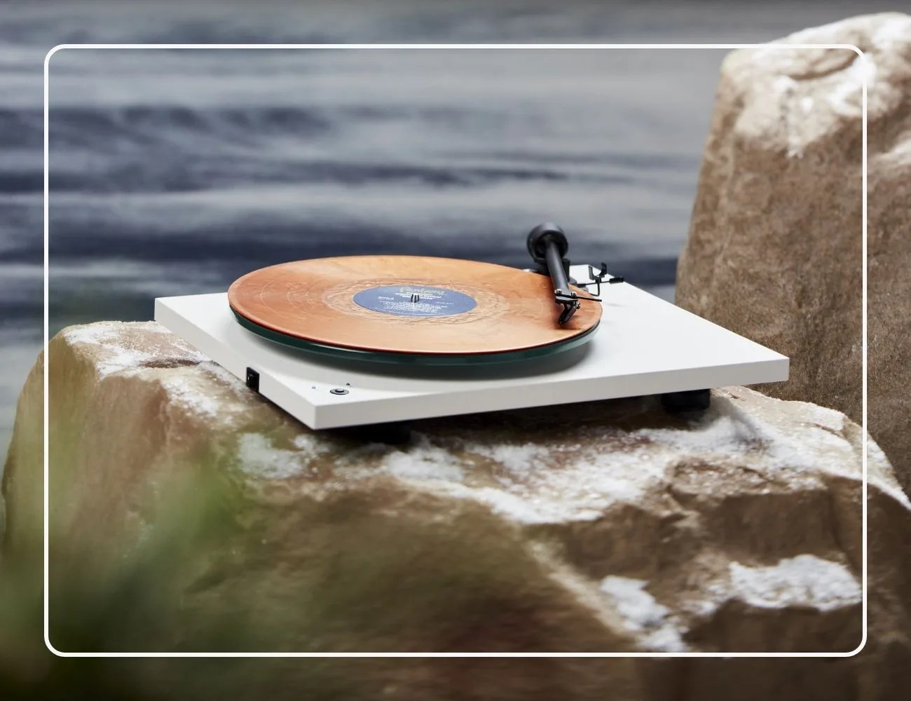 Pro-Ject T1 record player on snowy rocks