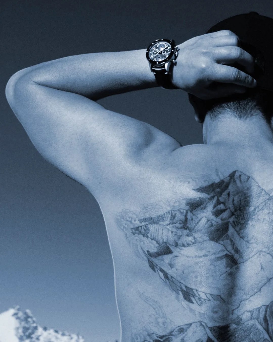 nimsdai purja showing his mountain back tattoo wearing a montblanc watch