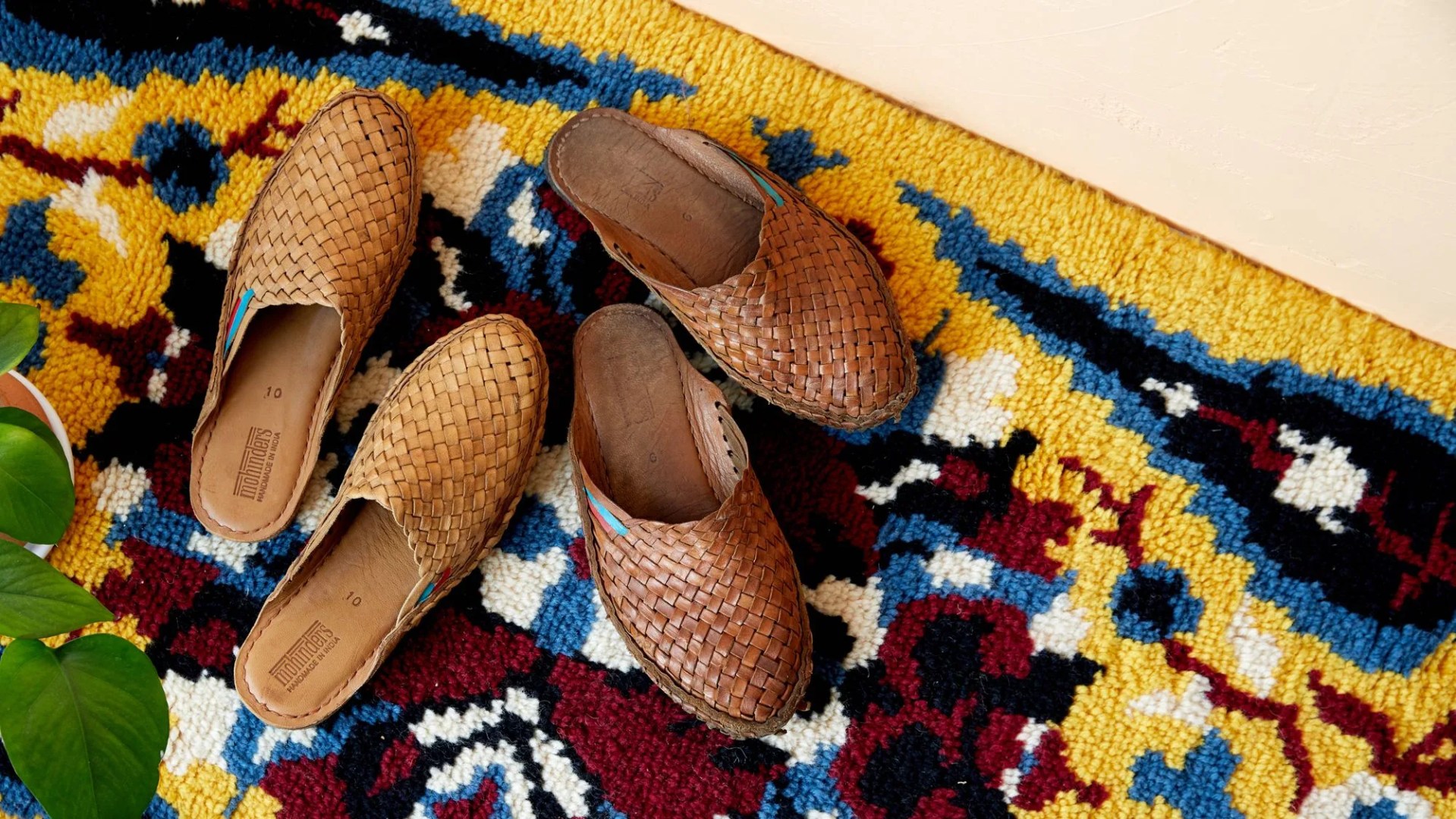 two pairs of mohinders slides on a carpet