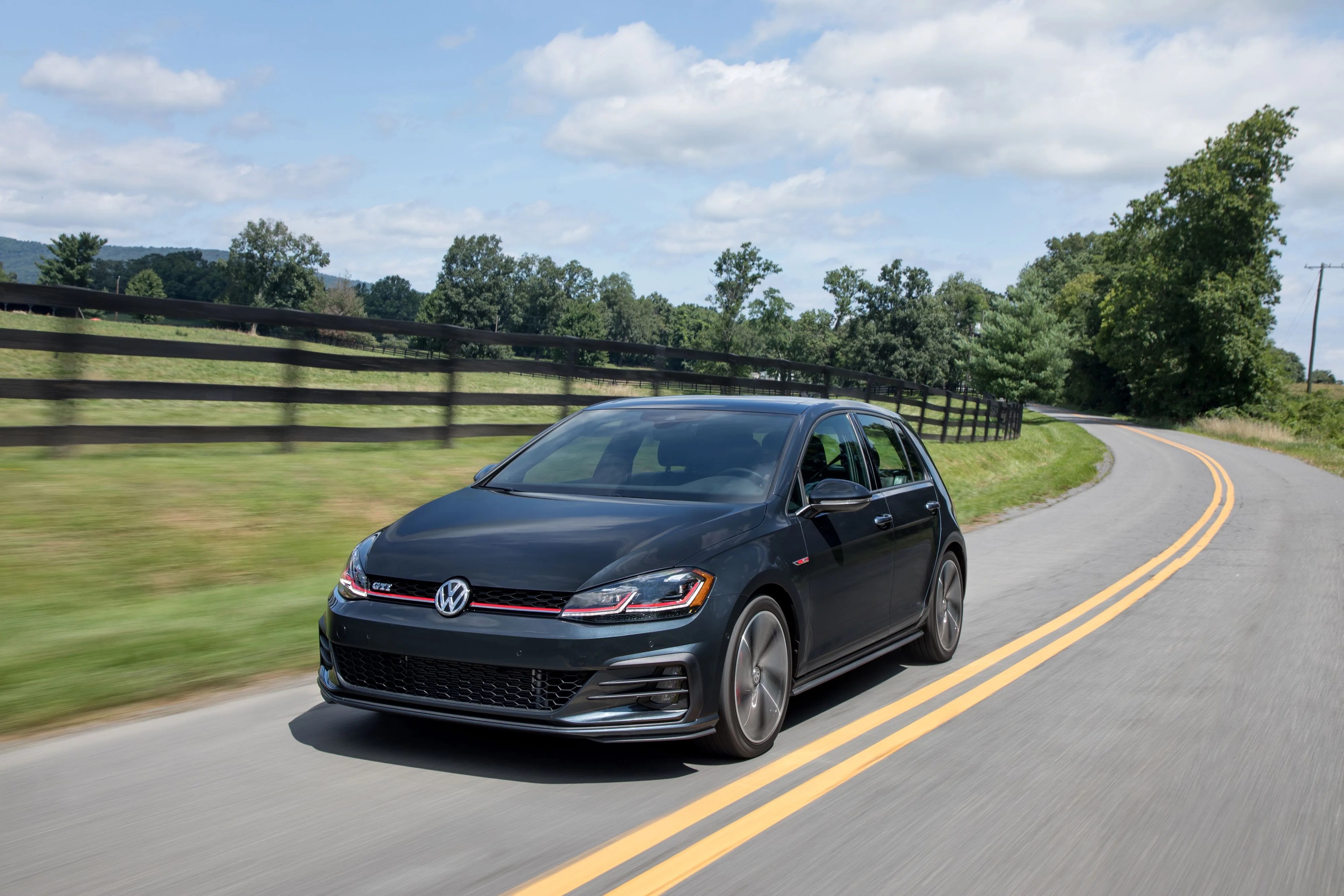 volkswagen golf gti on a country road