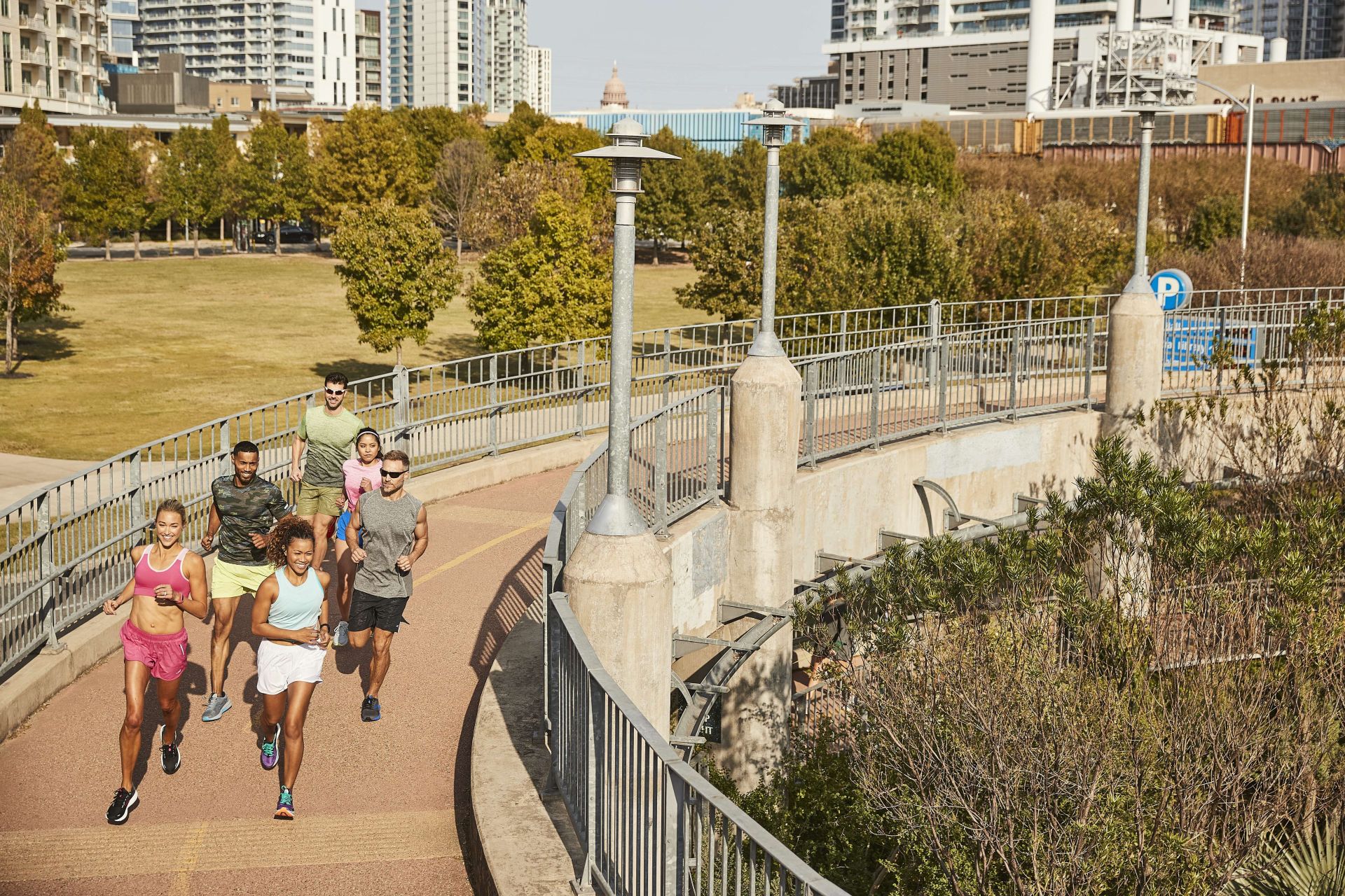 group of people running across ramp wearing brooks running gear
