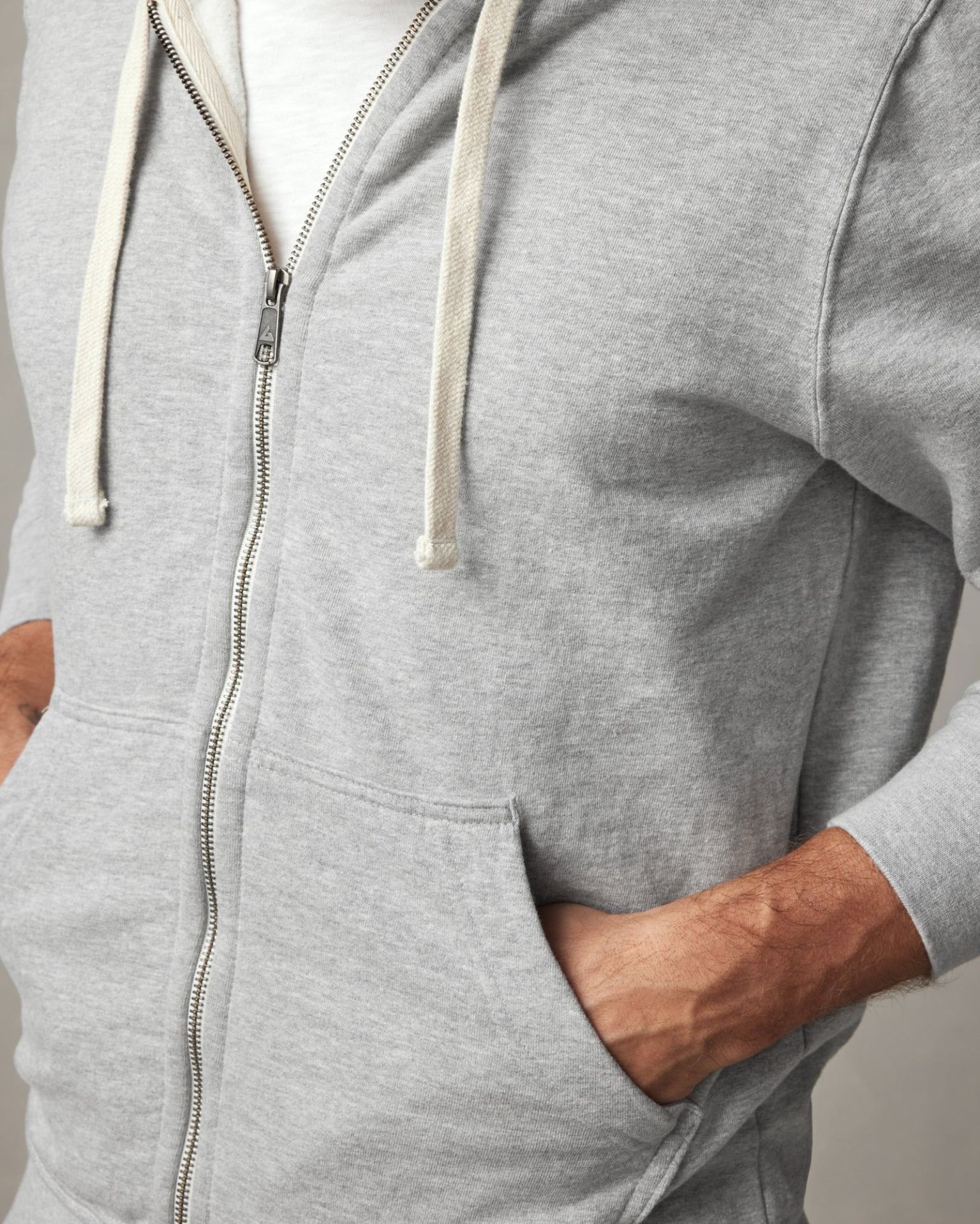 close up of the zipper on an american giant gray hoodie