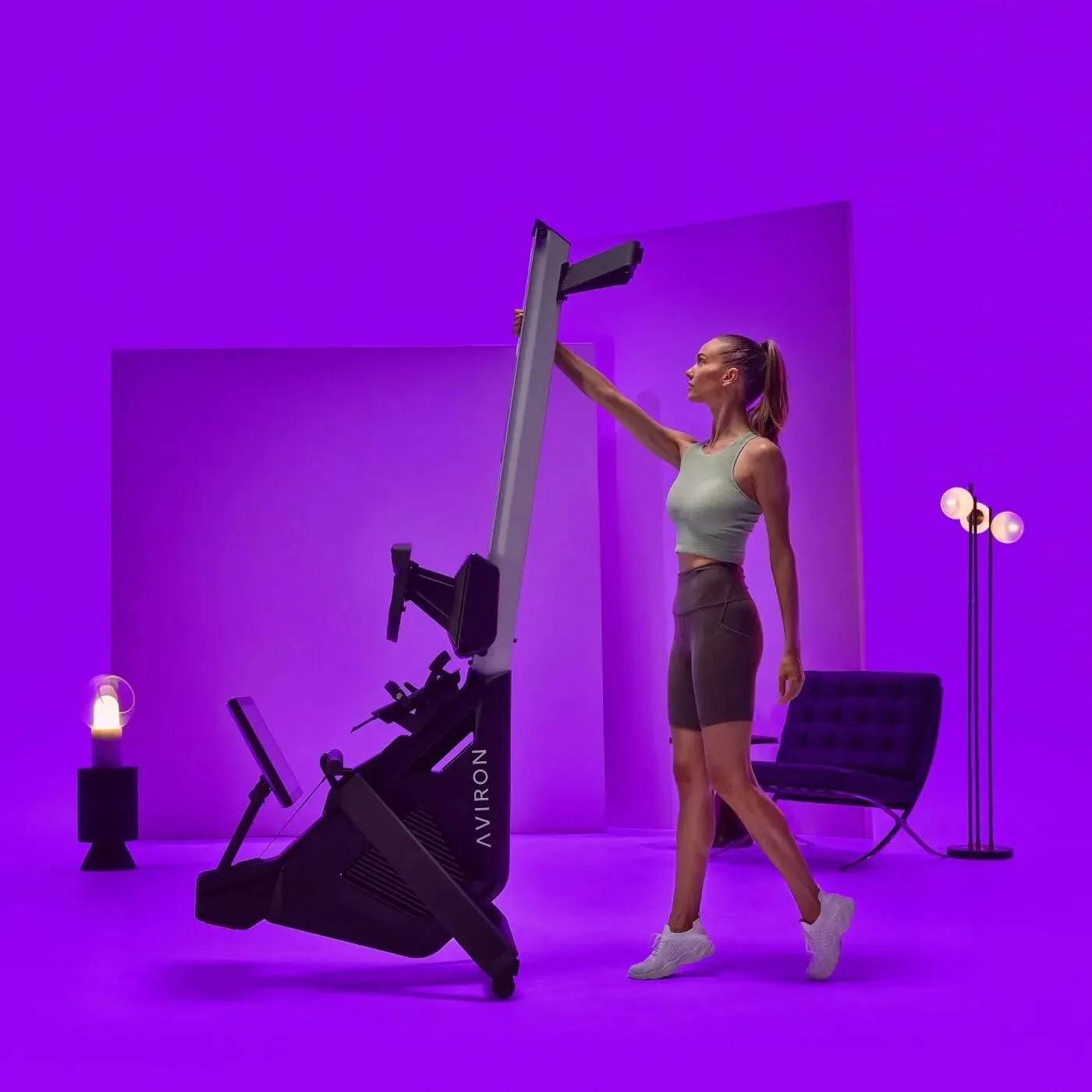 aviron strong series rower being folded by a woman