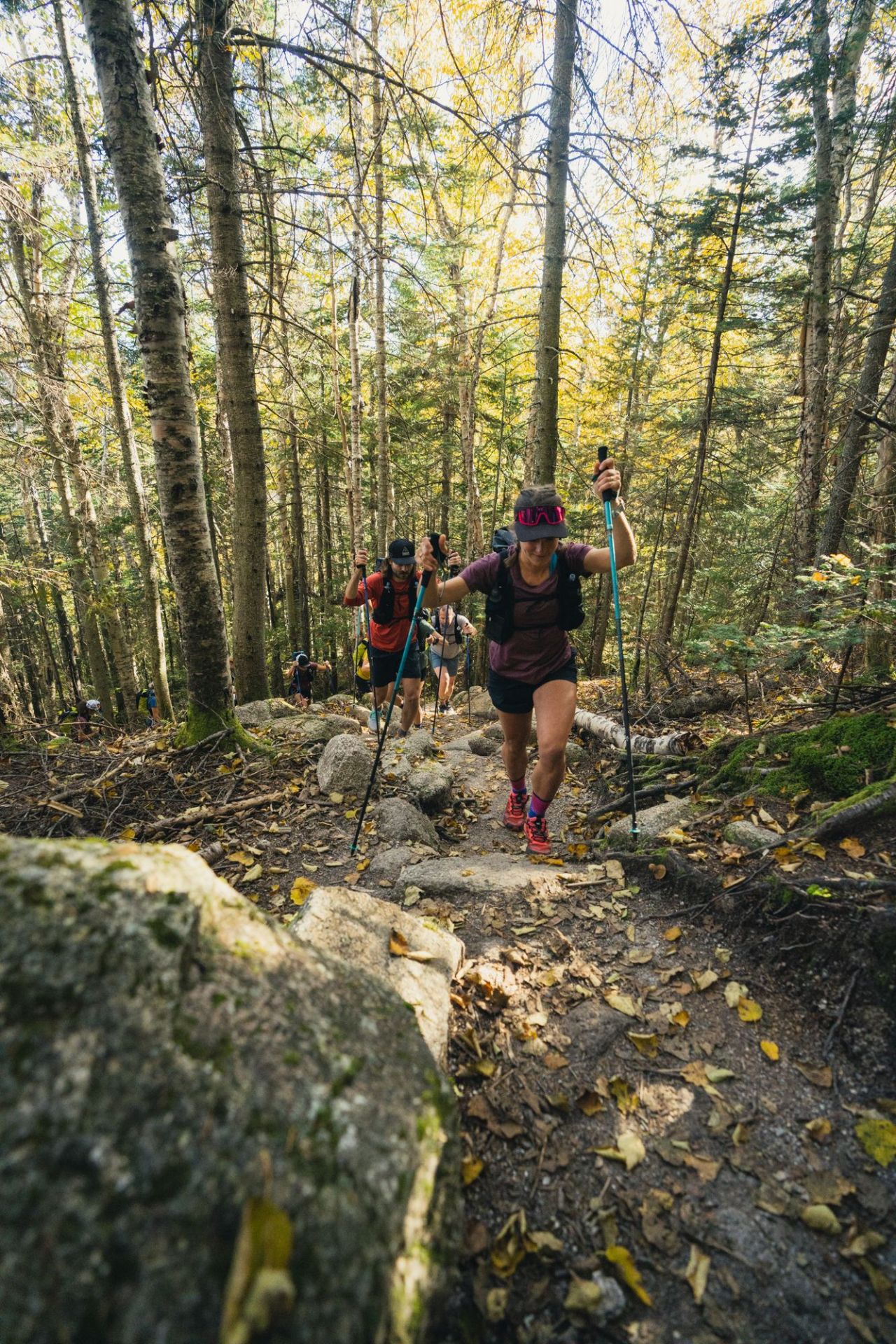 a group of people hiking through the mountains