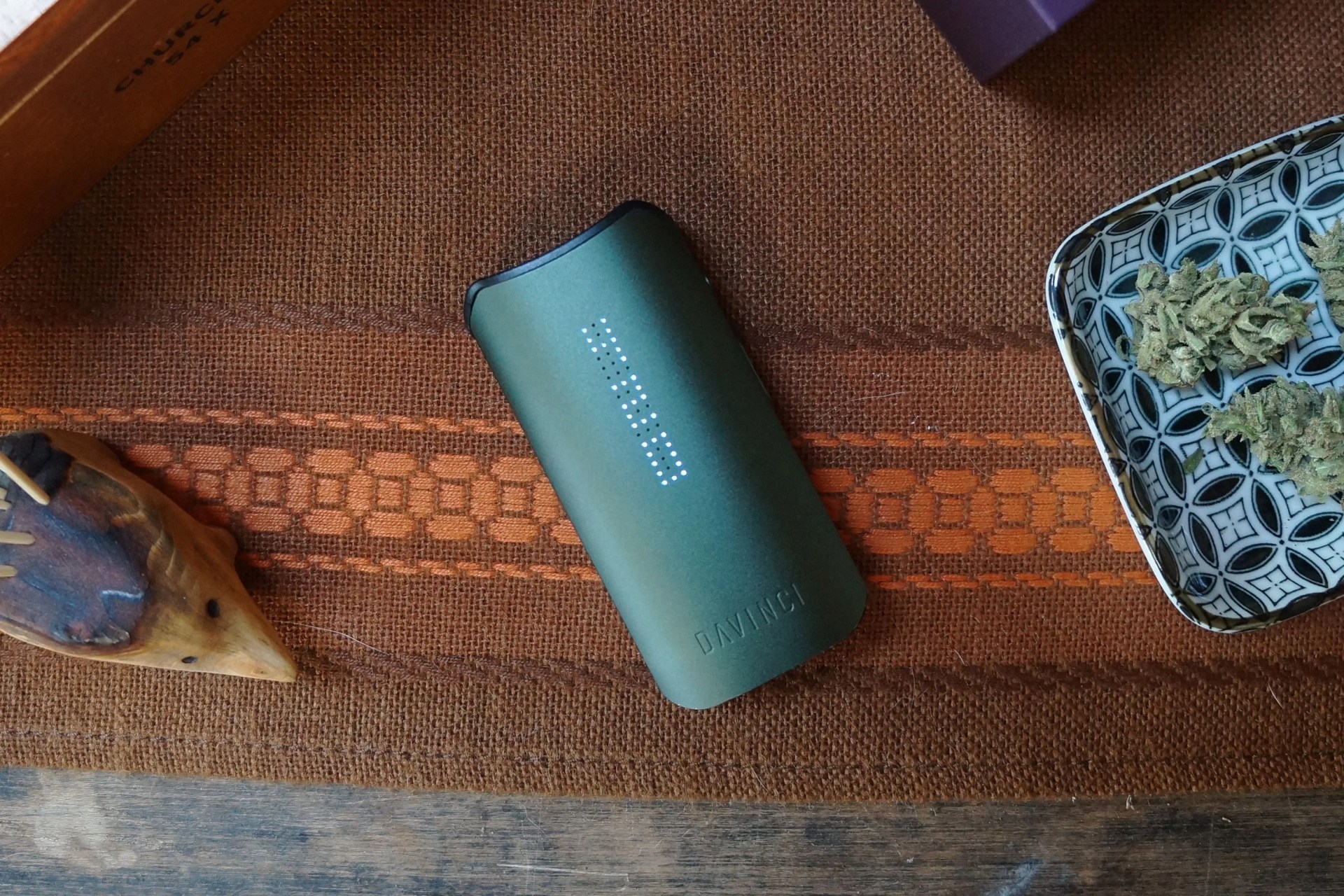 a green davinci iqc laying on a table