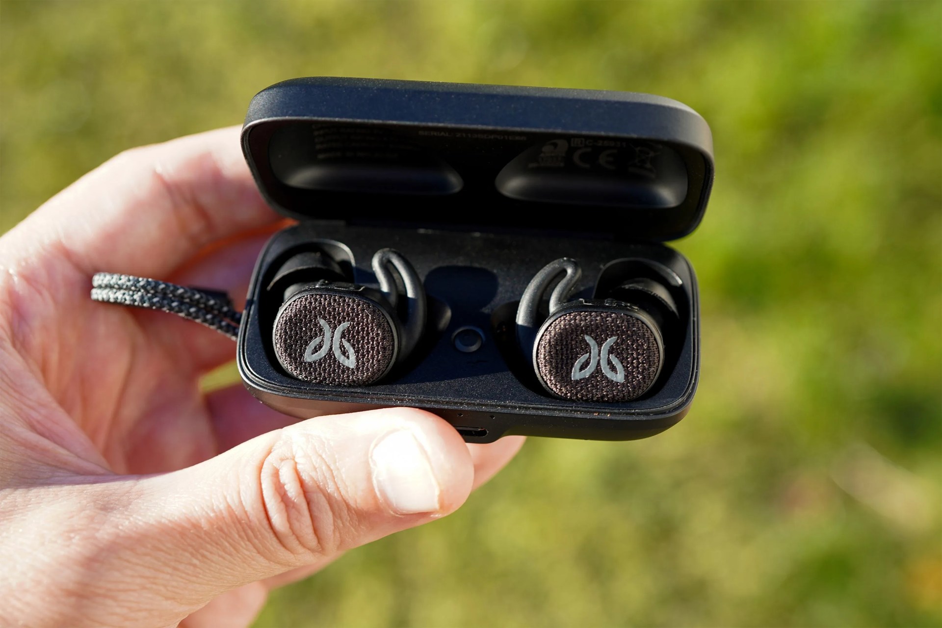 person holding the jaybird vista 2 earbuds