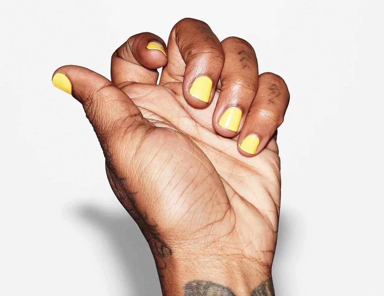 fingers with crete nail polish