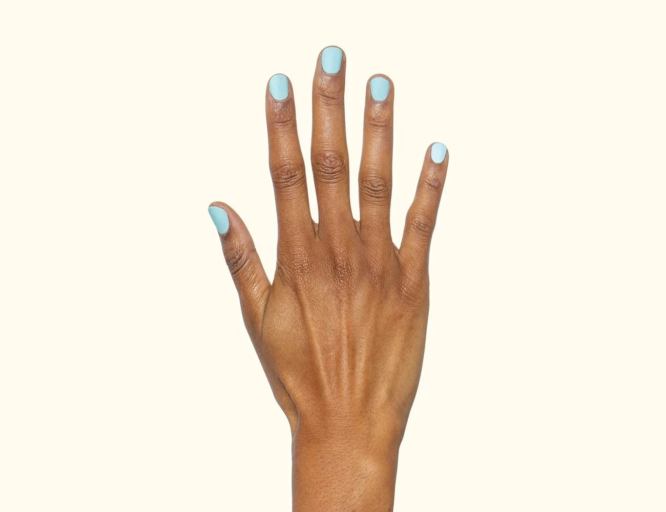 fingers with golf le fleur nail polish