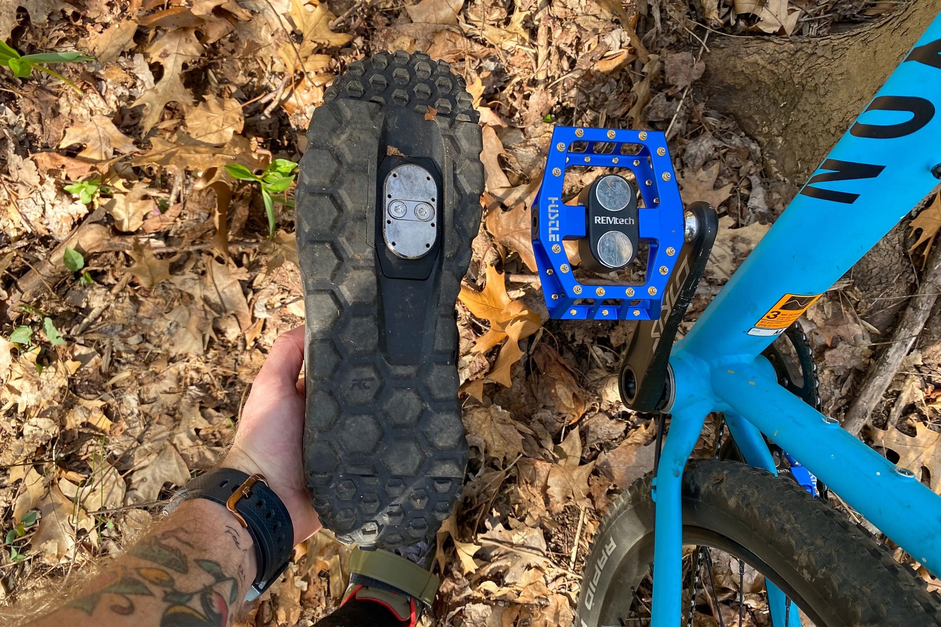 rem tech magnetic bike pedal next to the underside of a bike shoe with magnet on the bottom