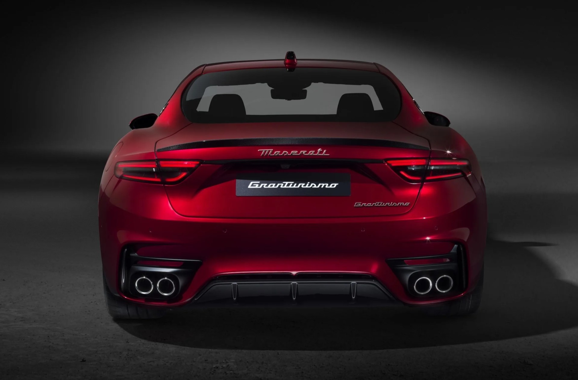 maserati granturismo with a black studio background