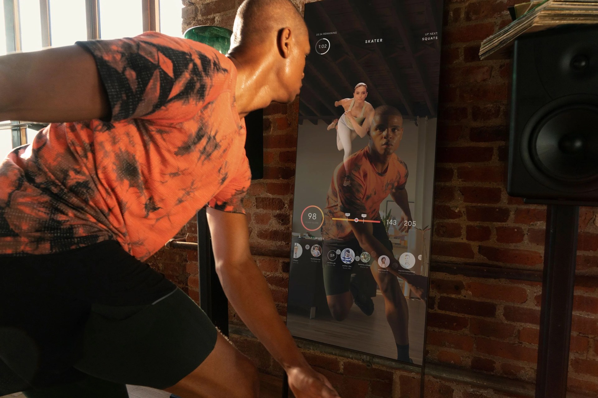 man exercising in front of mirror
