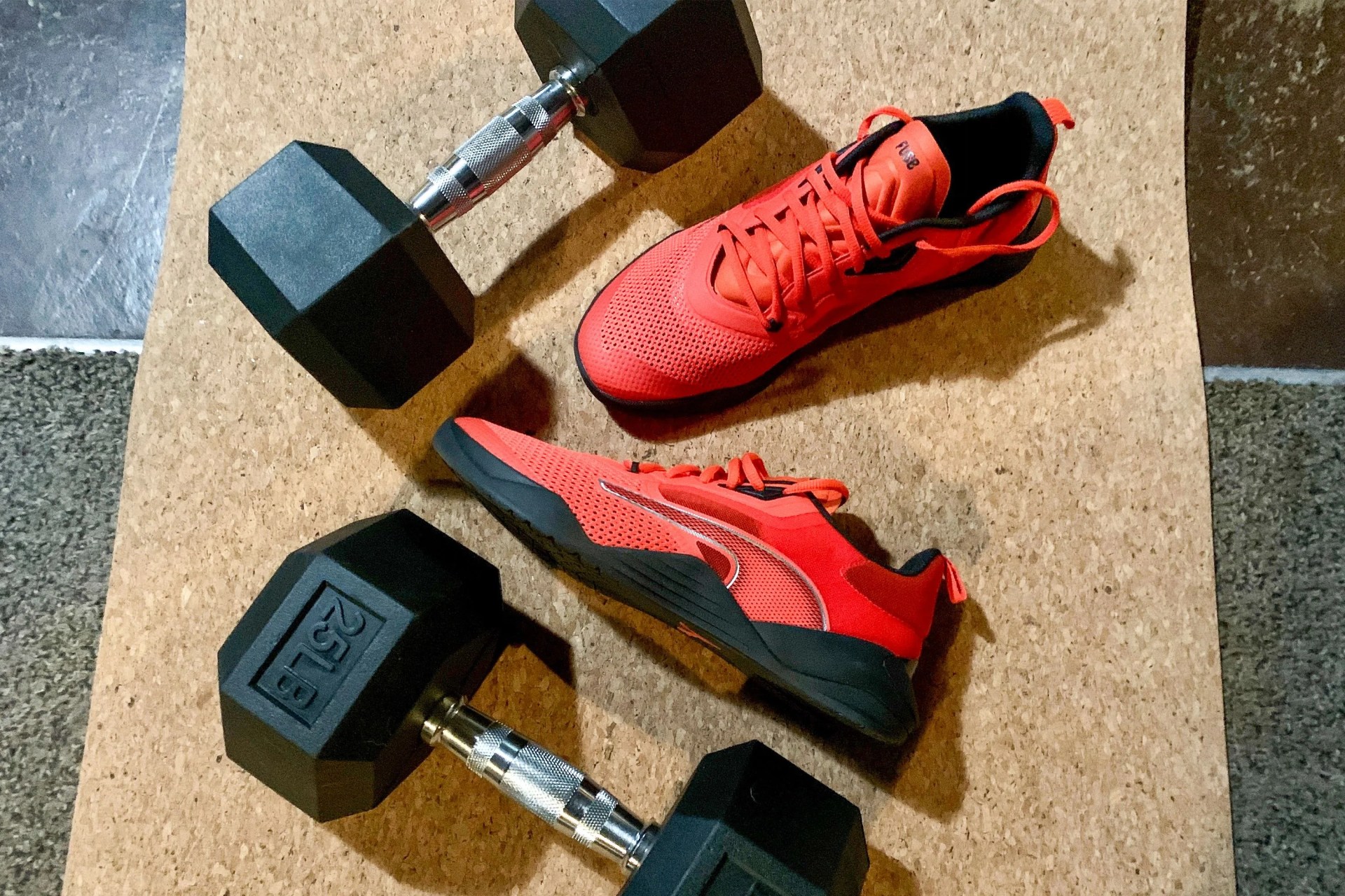 puma fuse shoes on a yoga mat with dumbbells