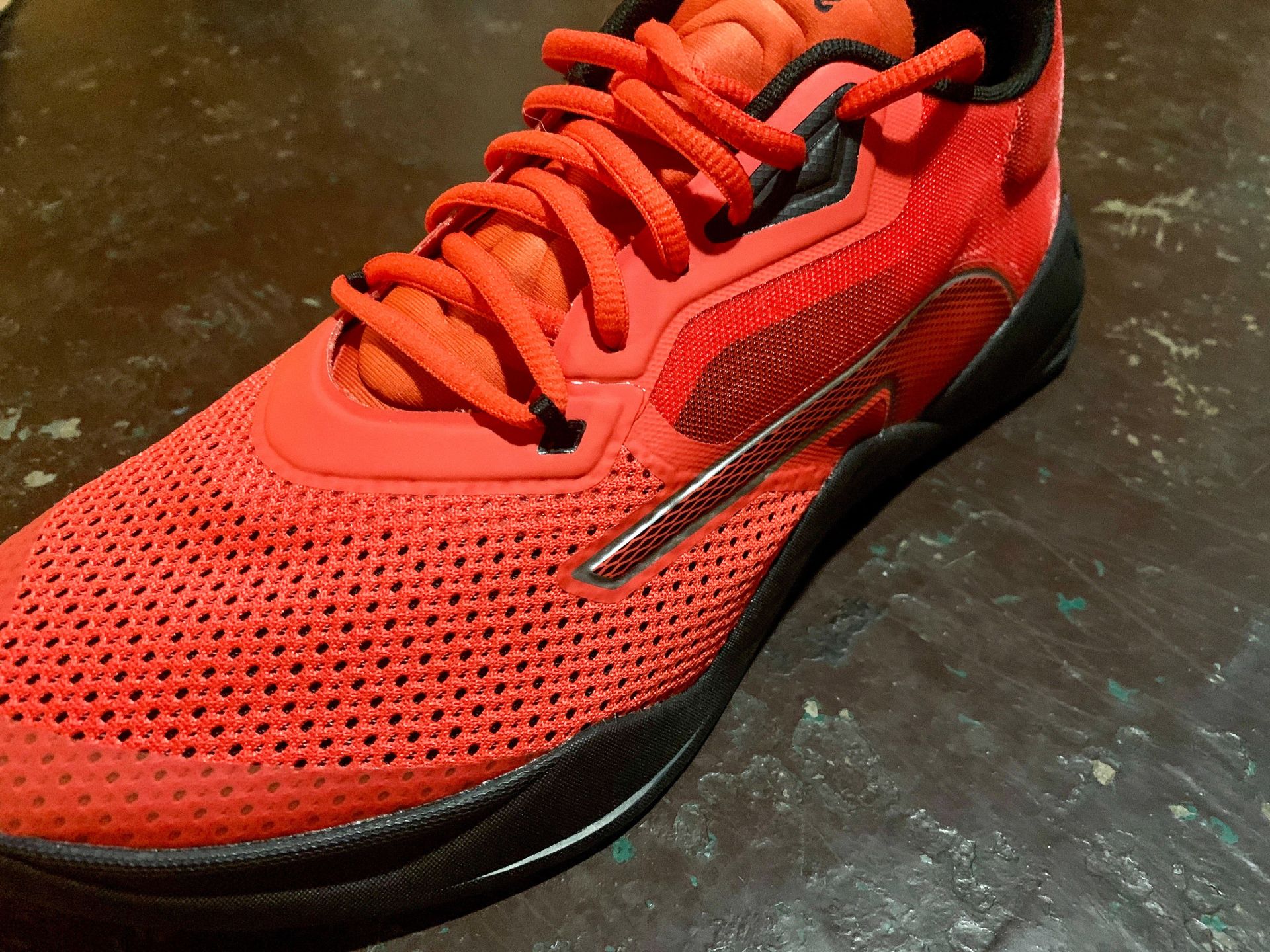 close up of the toe side on a red puma fuse shoe