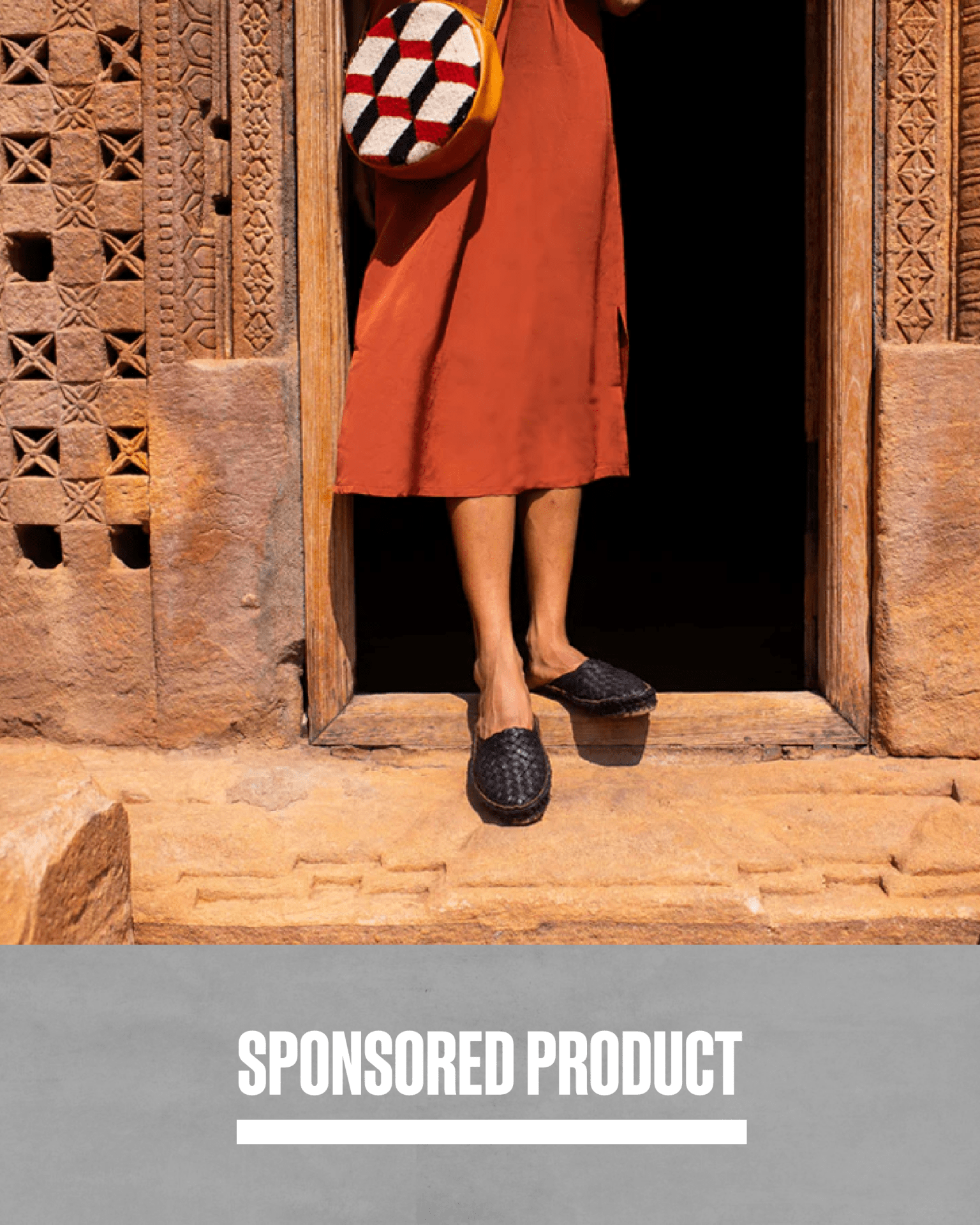 a person standing in a doorway wearing mohinders woven city slippers