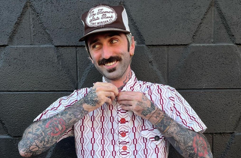 man wearing a vintage hat and shirt