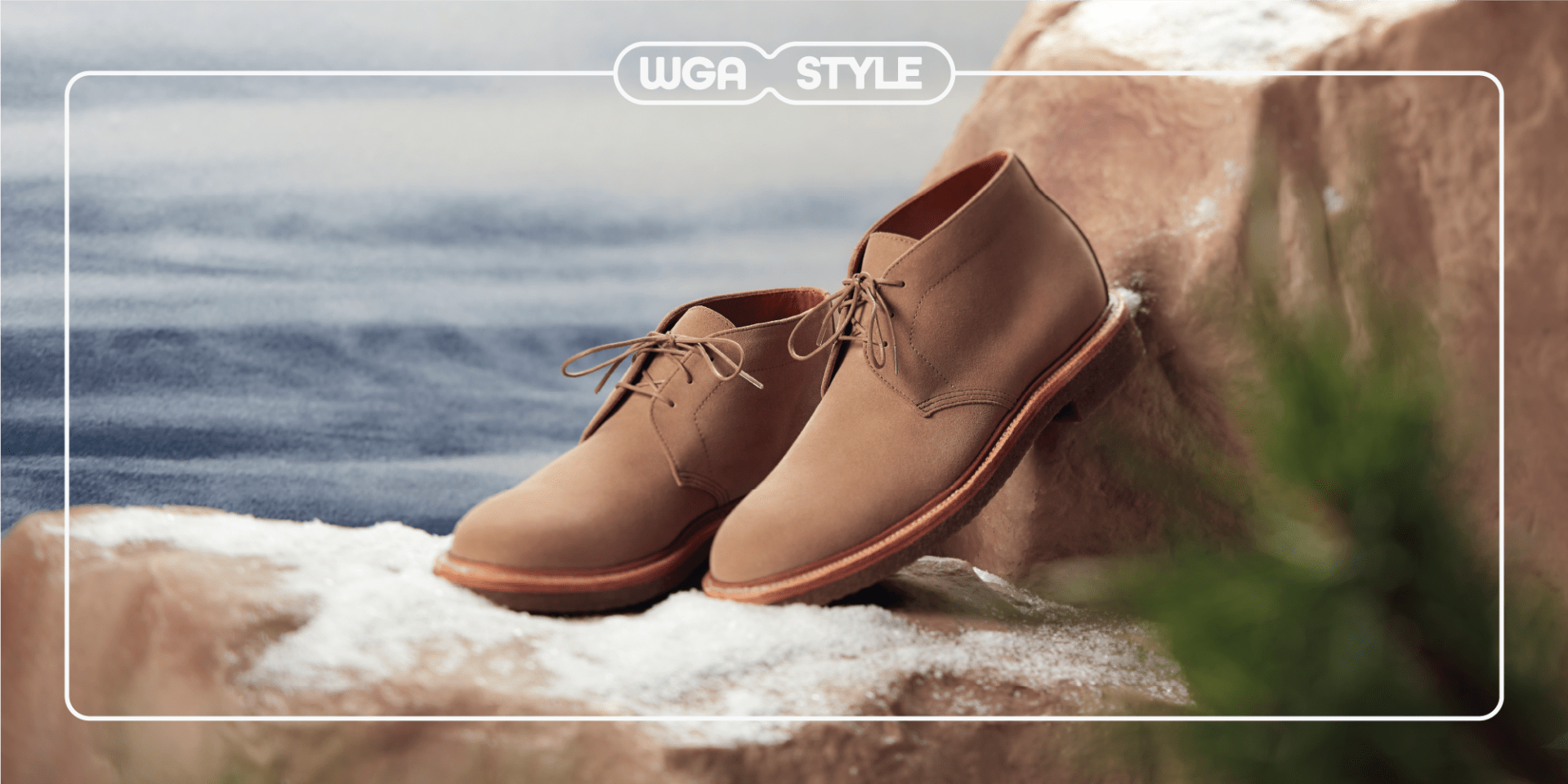 brown shoes sitting on snowy rocks