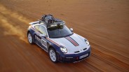 porsche 911 dakar driving on sand