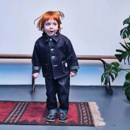 a red headed child wearing the dawson denim juniors collection while running towards the camera smiling