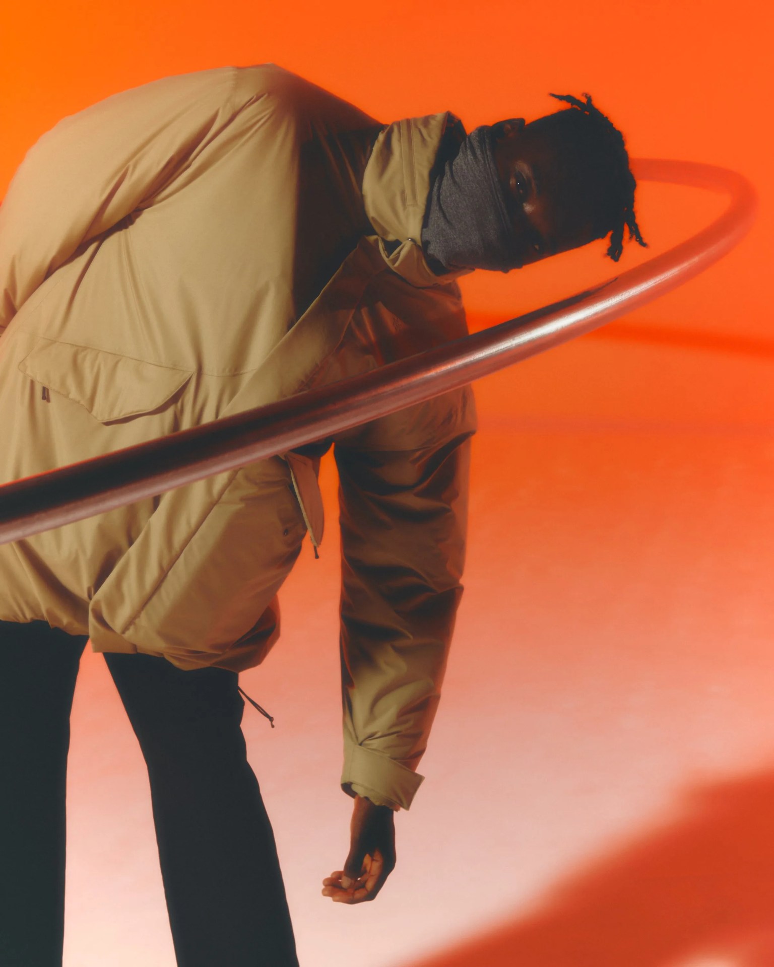 man wearing goldwin gore tex infinium puffy jacket