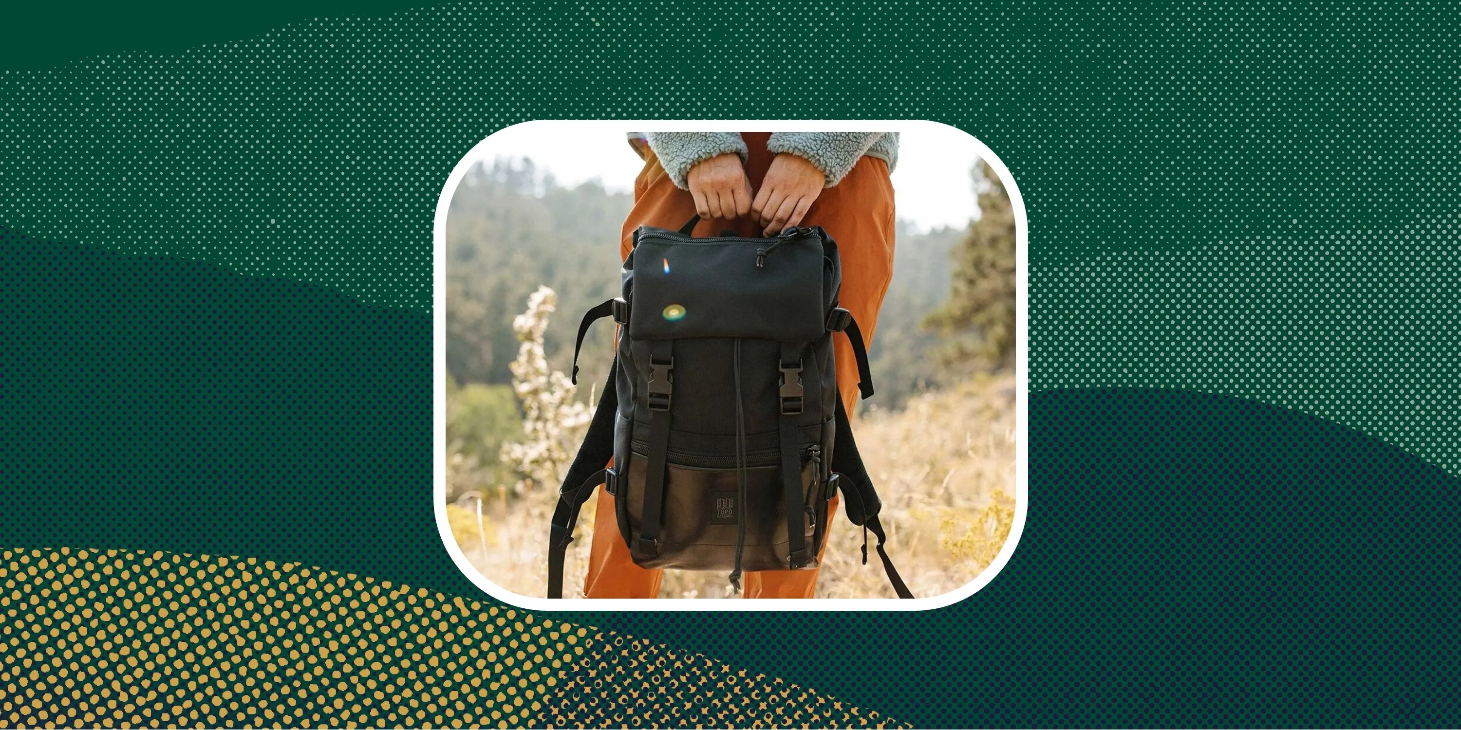 backcountry sponsored deal person holding black backpack standing in field