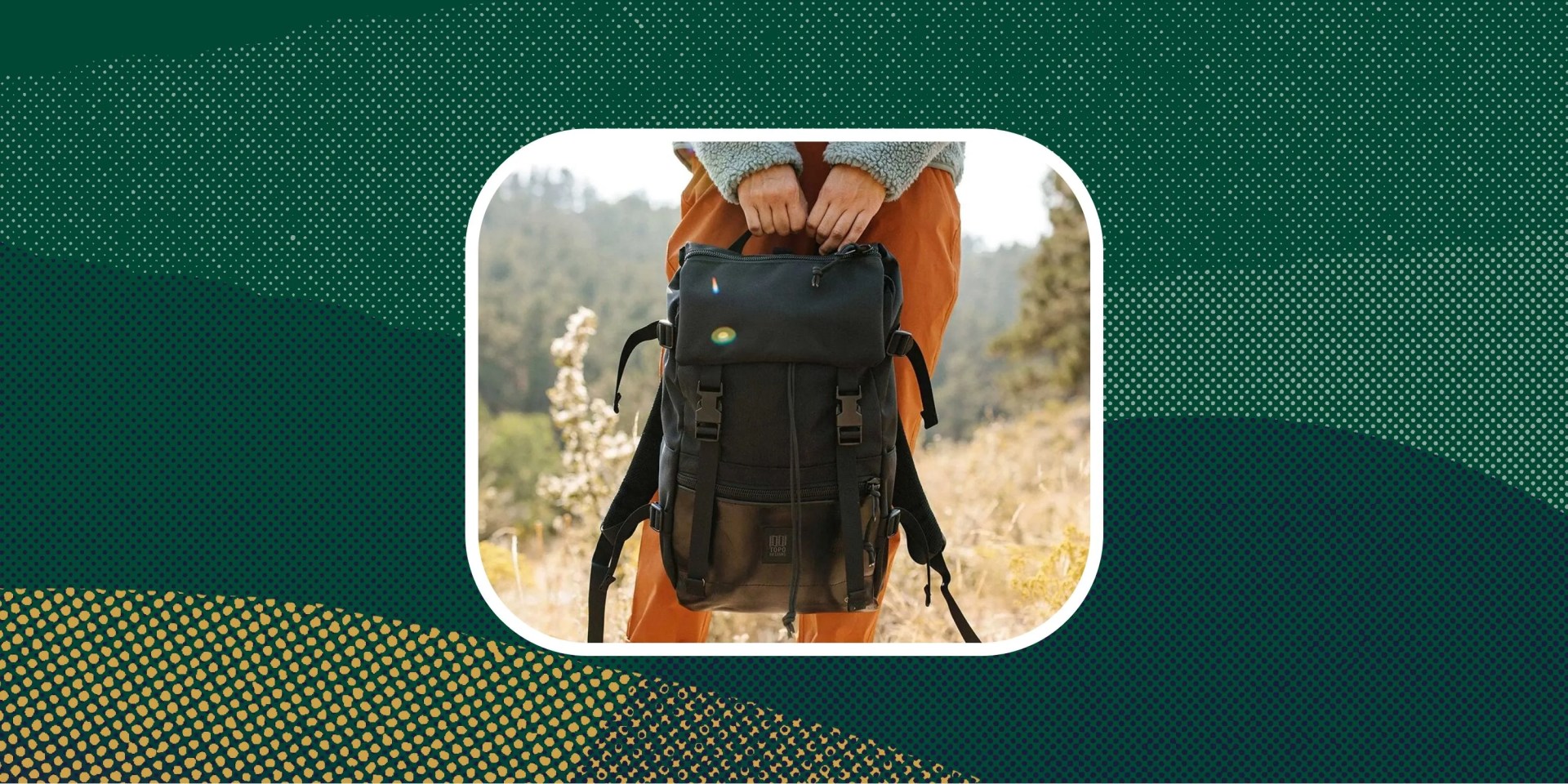 backcountry sponsored deal person holding black backpack standing in field