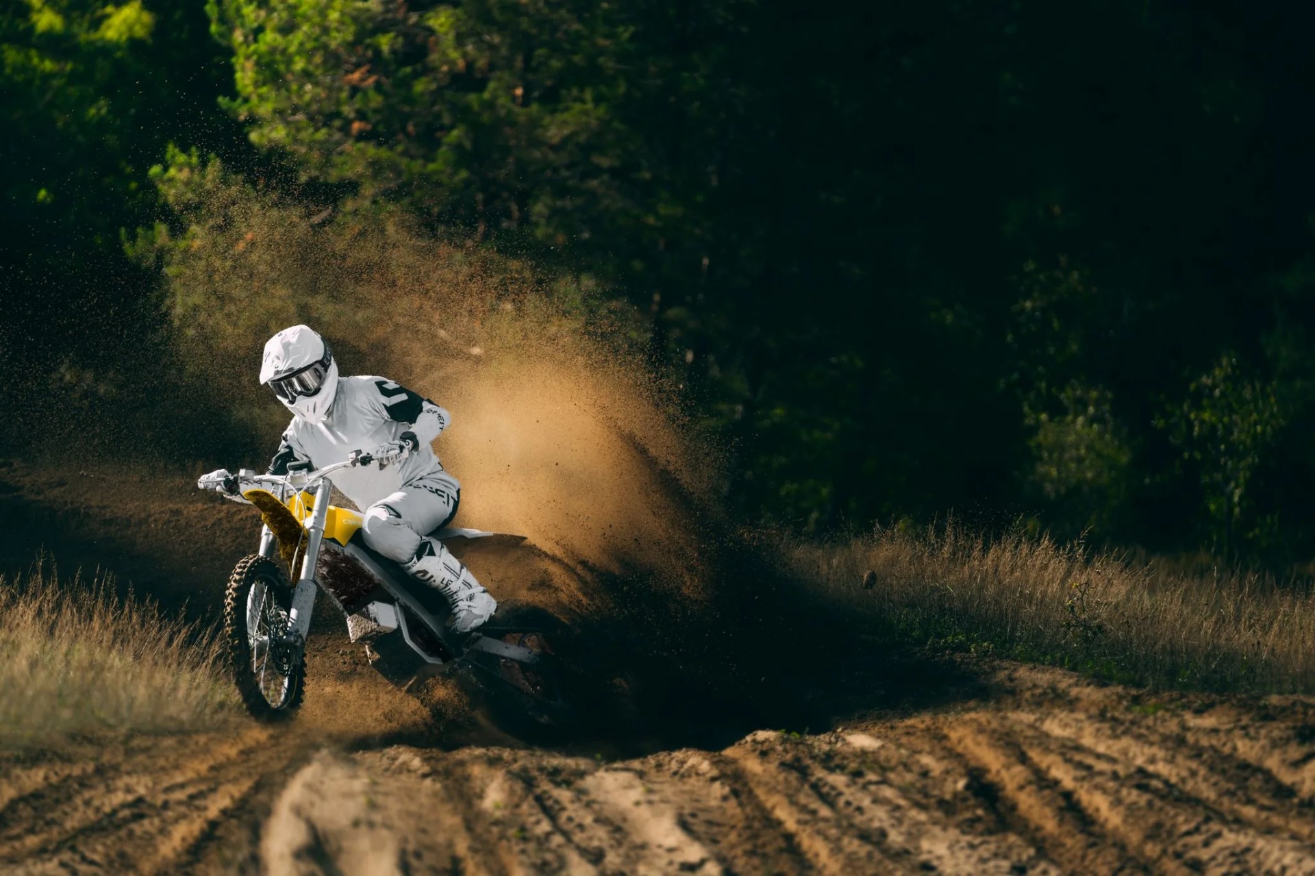 rider kicking up dirt in the cake bukk off road motorcycle