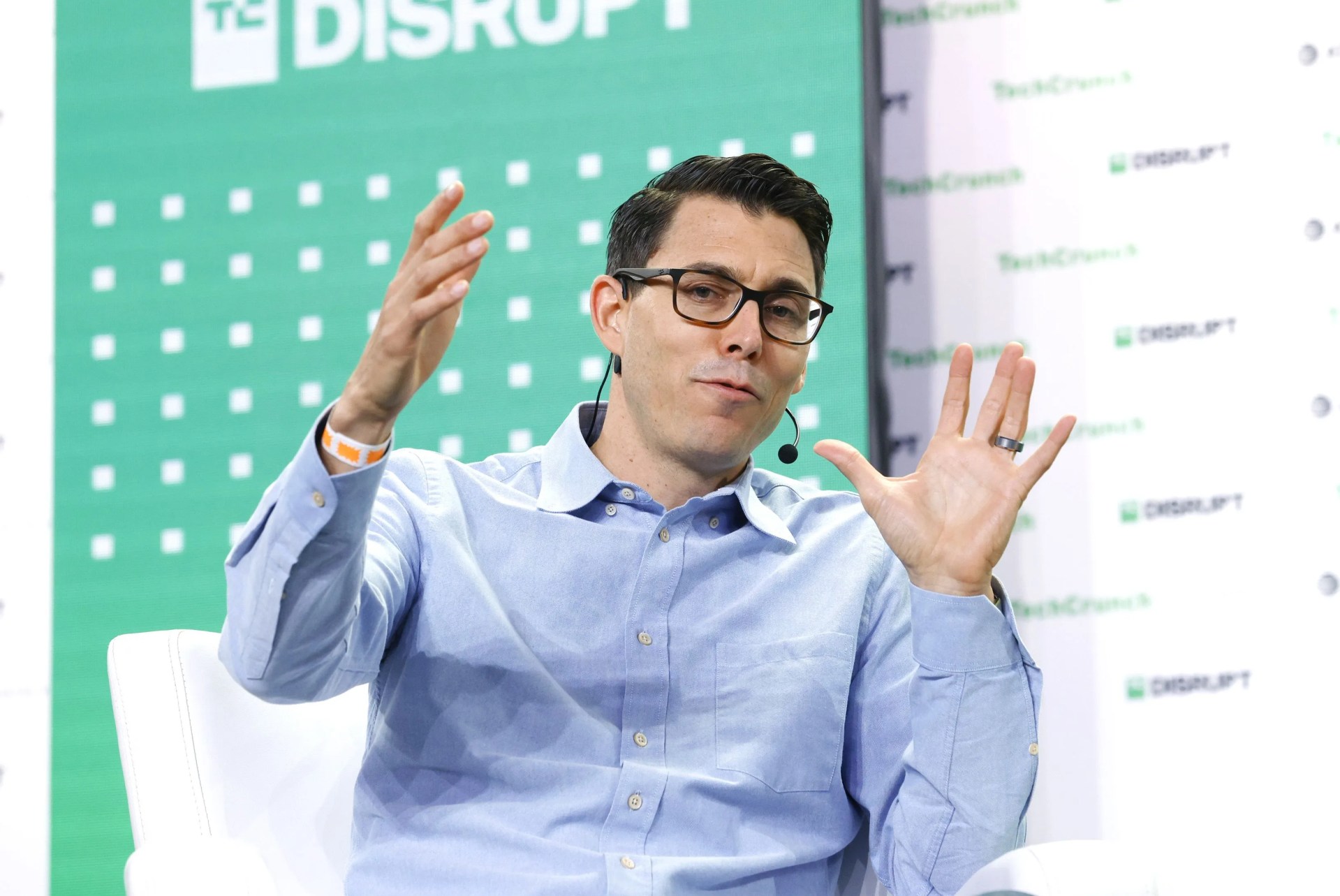 rj scaringe speaking at tech disrupt and gesturing