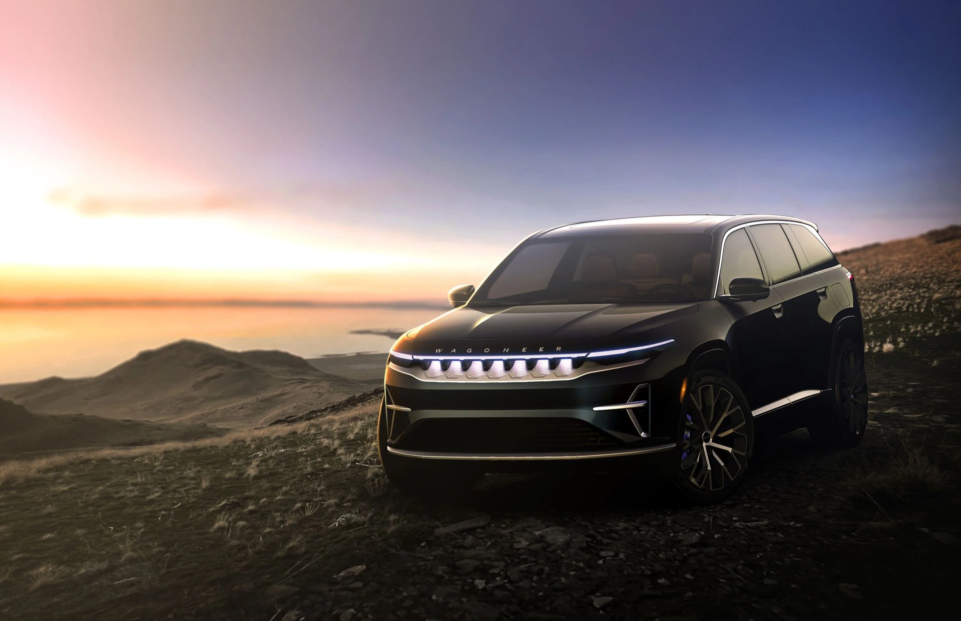 wagoneer s rendered on rocky cliff overlooking the ocean