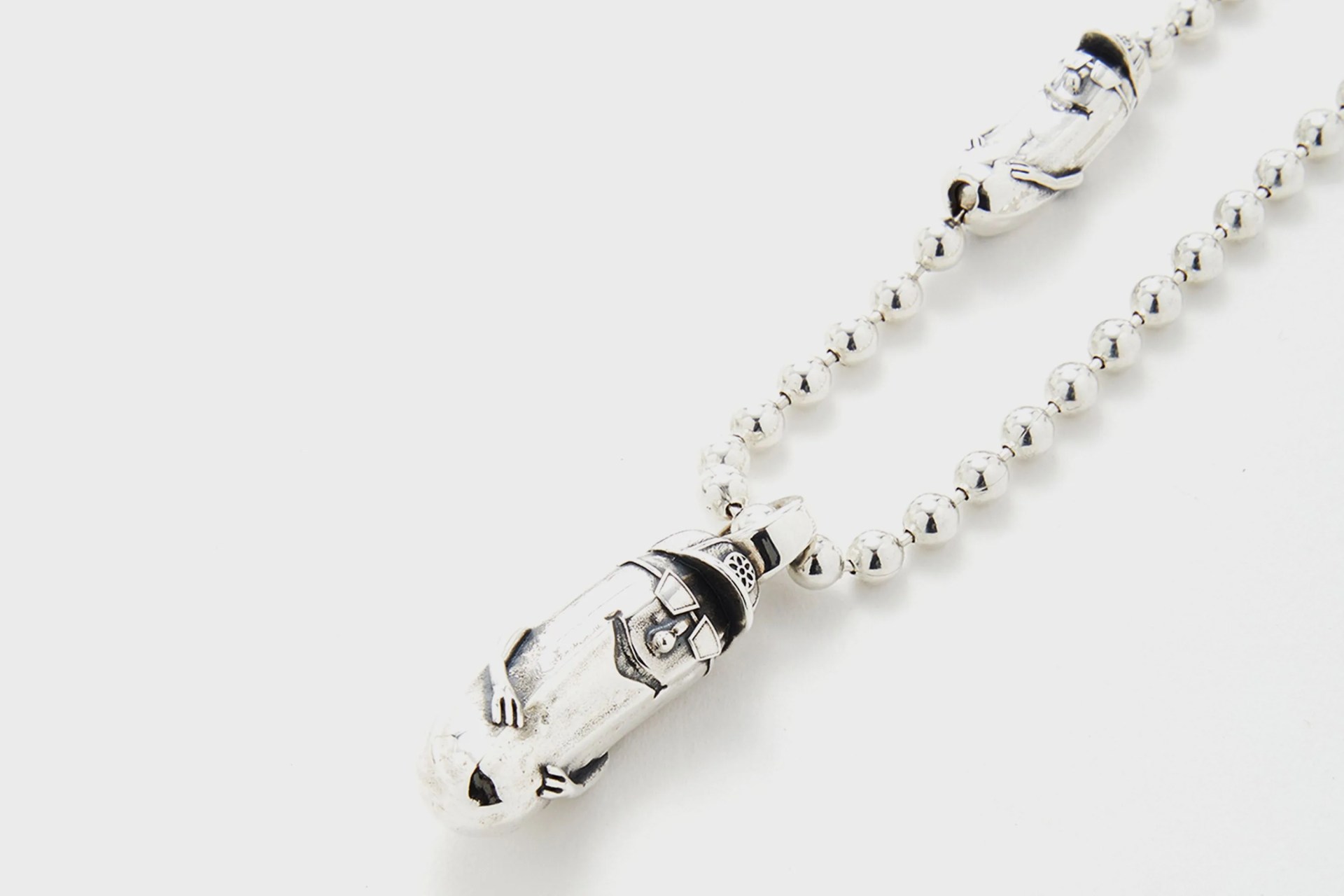 a ball chain necklace with a pickle pendant and pickle clasp