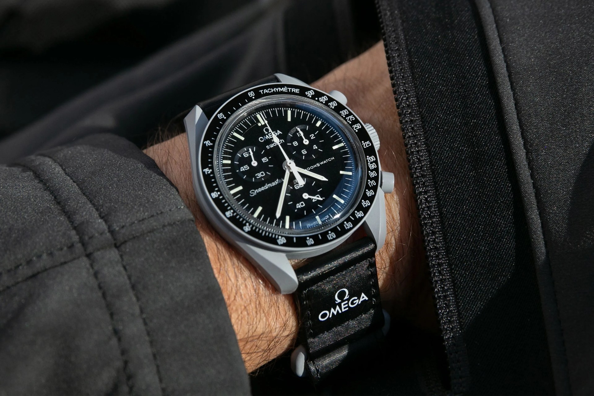 a man wearing an omega watch