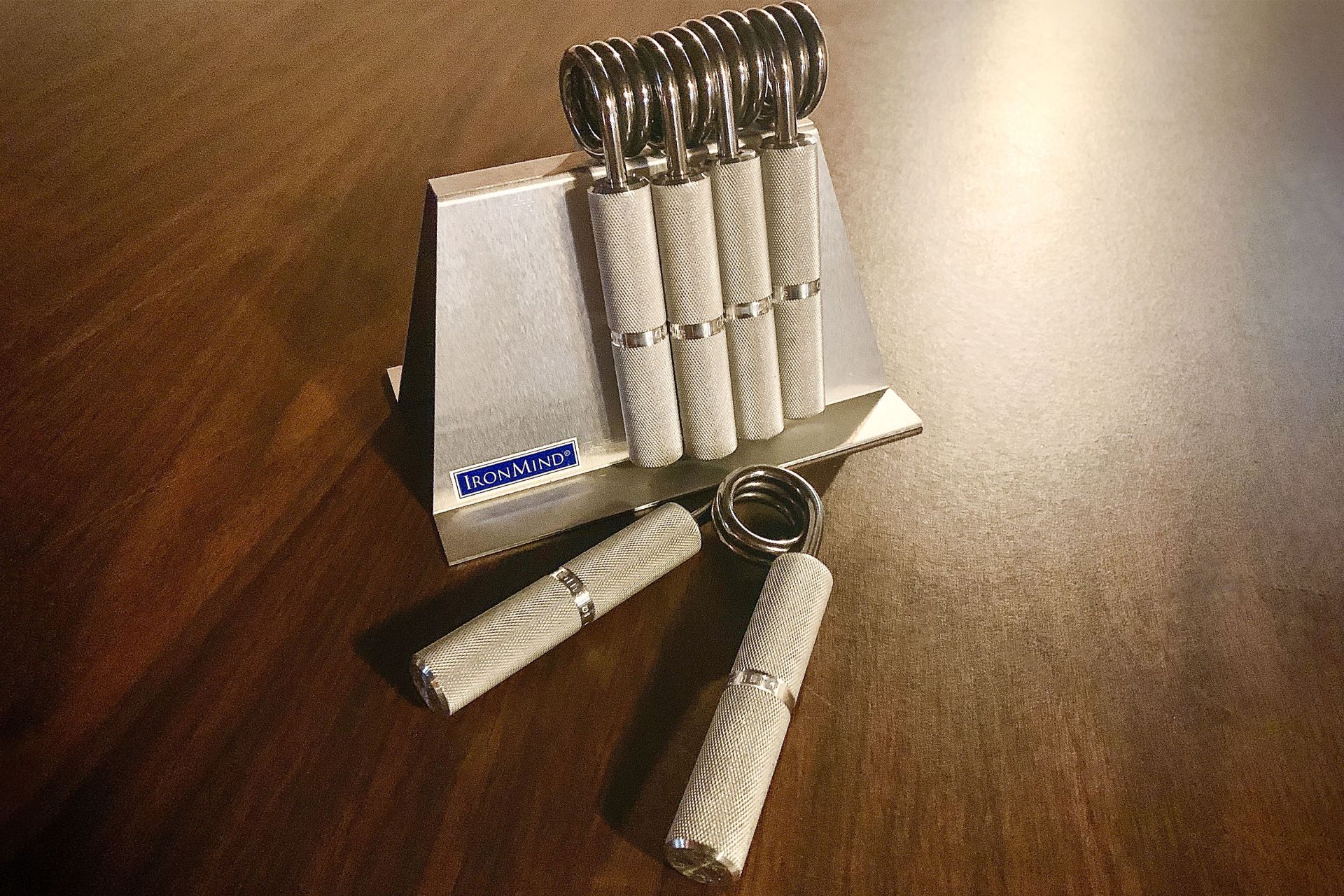 ironmind captains of crush grippers on a table
