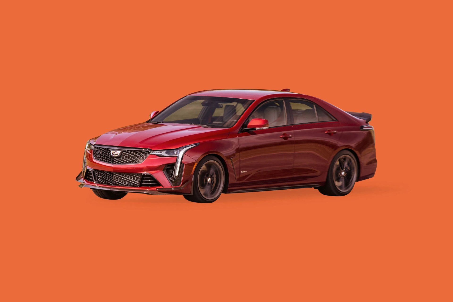 red cadillac ct4 v blackwing on orange background