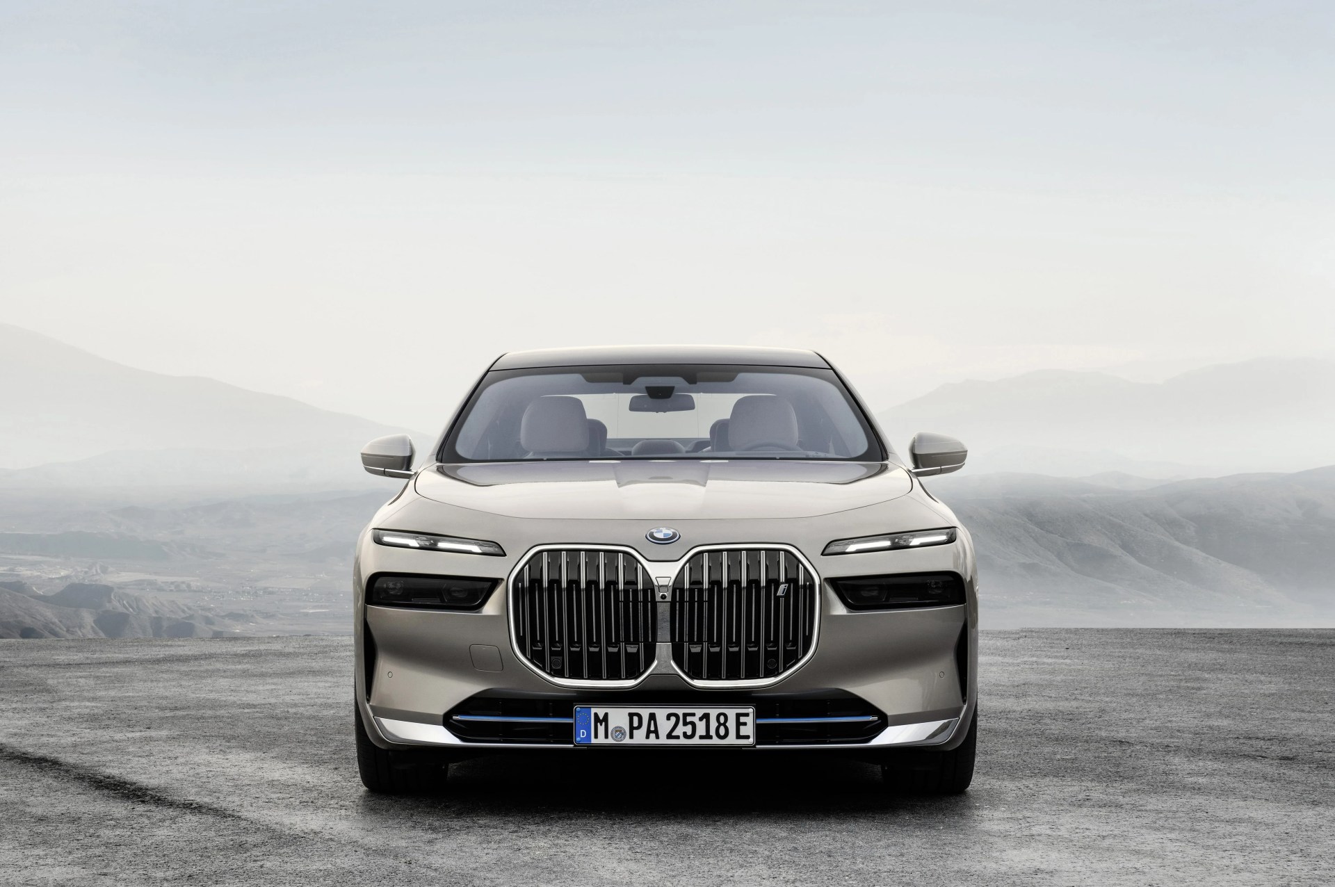 bmw 7 series with mists and mountains in background