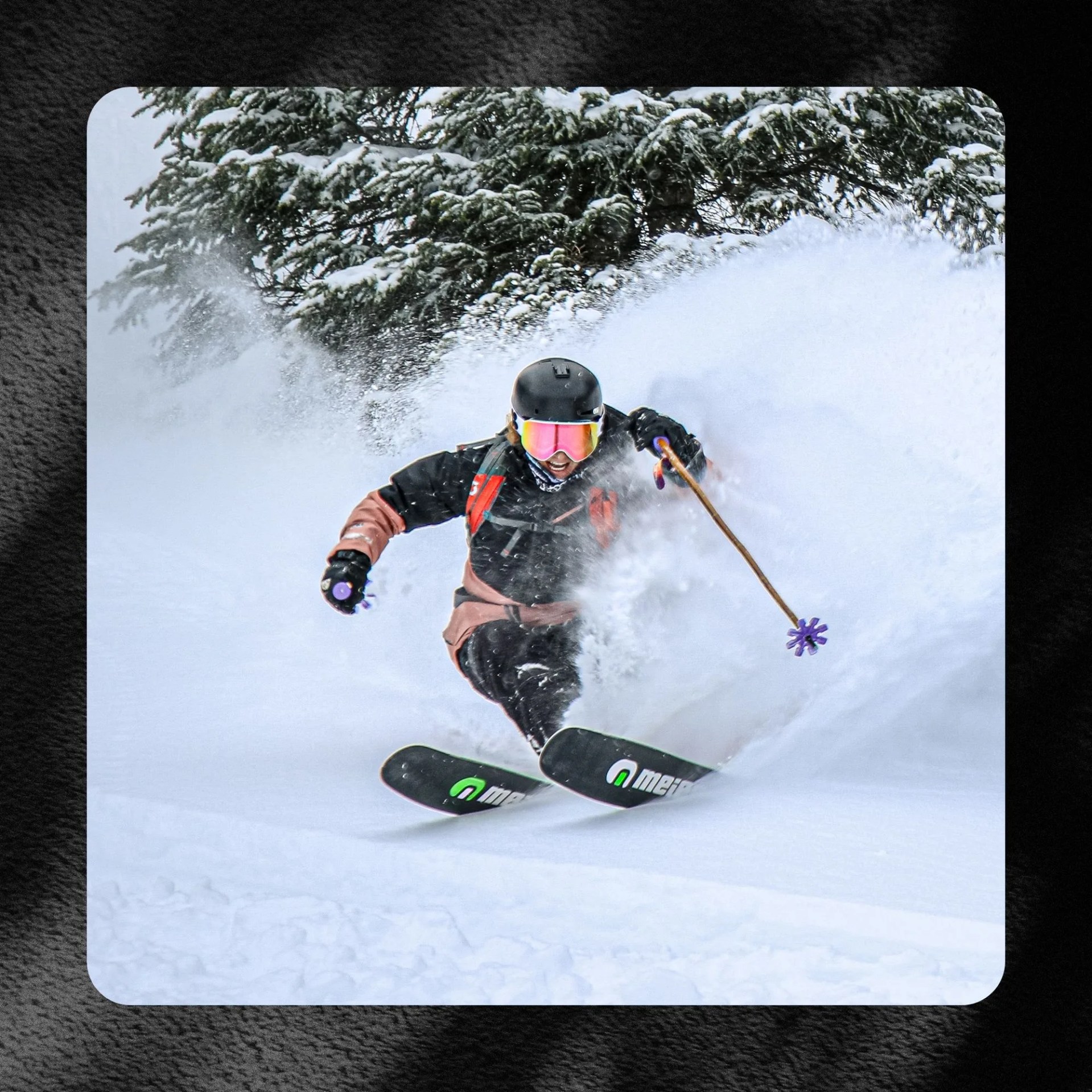 person skiing down a snowy hill