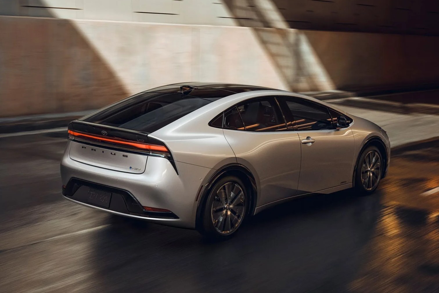 new toyota prius driving through a dark tunnel