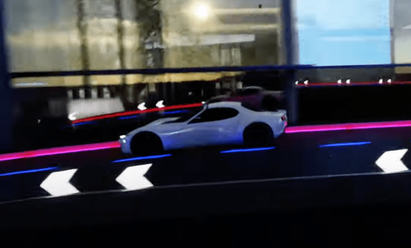 mazda electric sports car concept driving on a futuristic highway