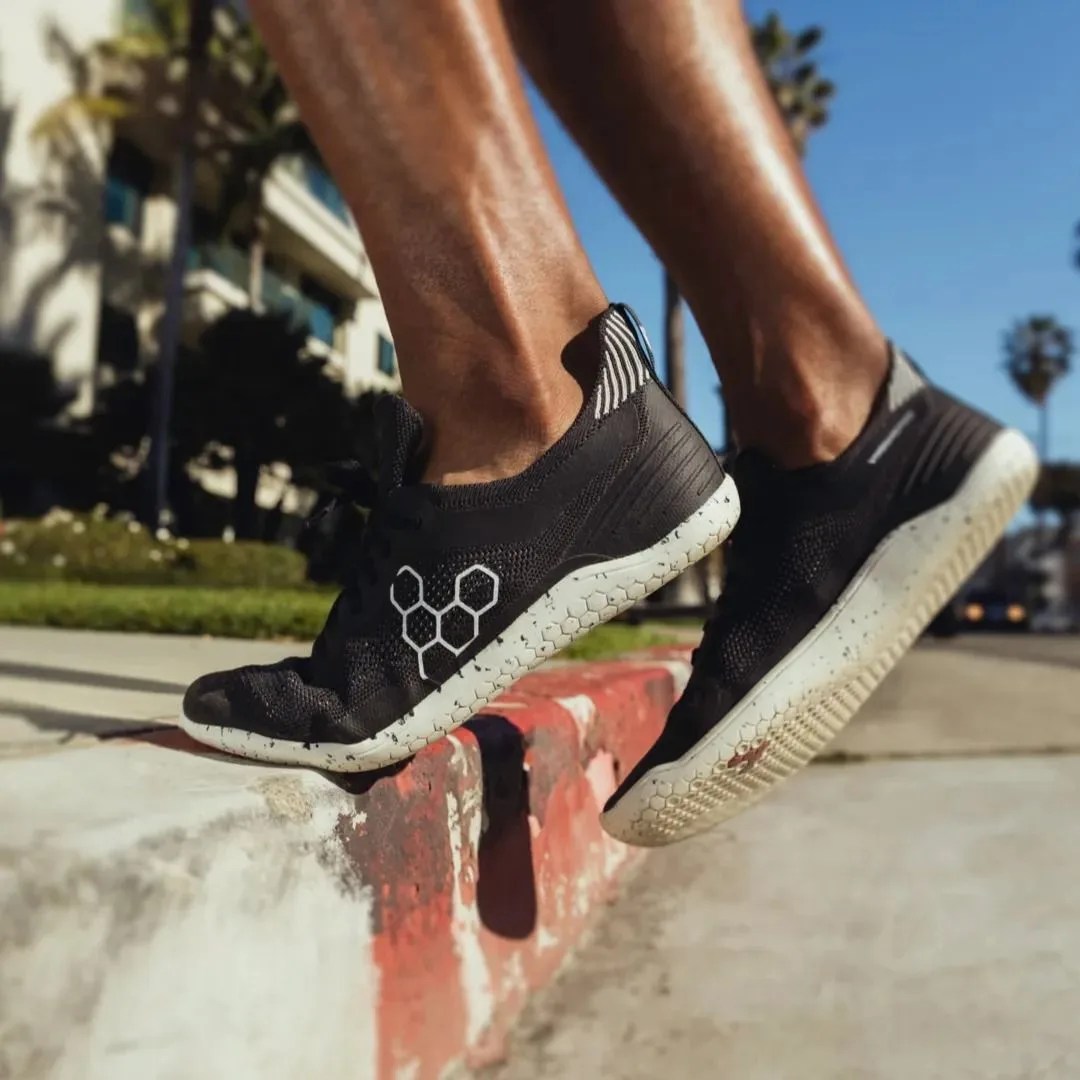 a man stepping up on a curb