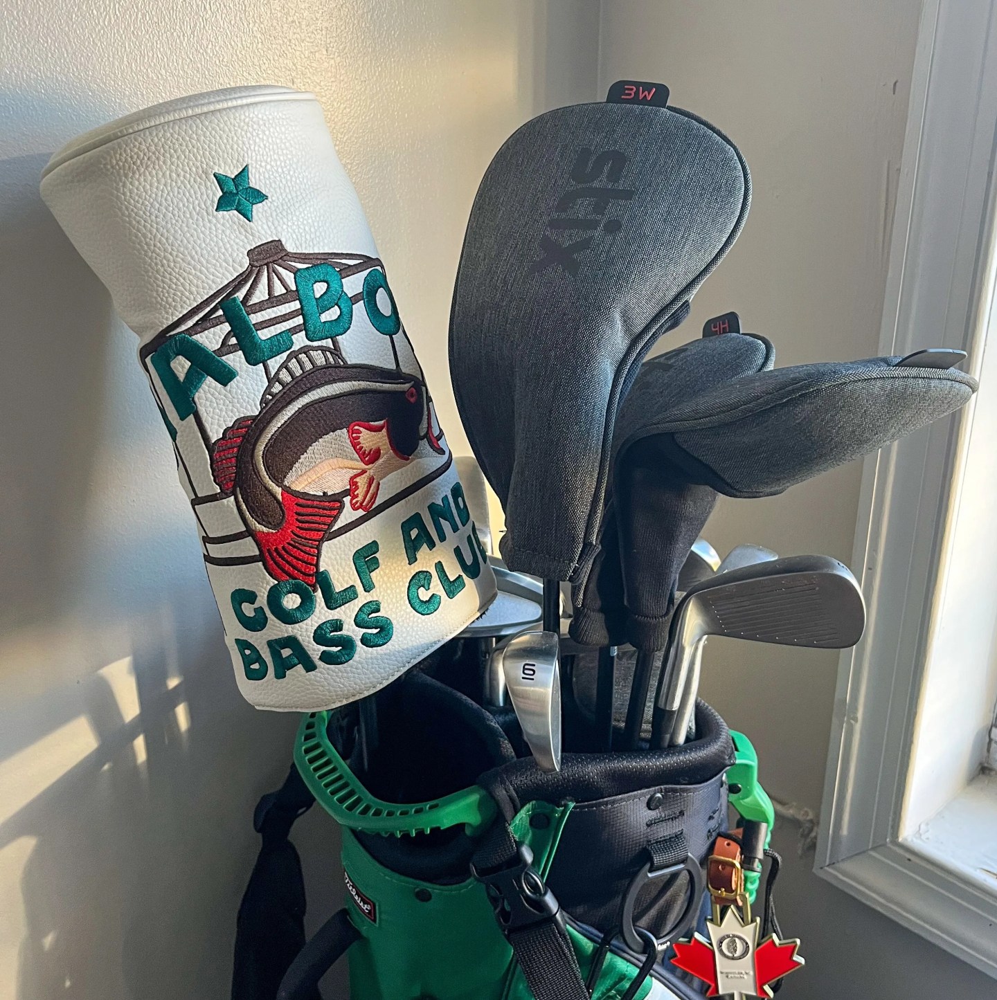 set of golf clubs sitting in a corner