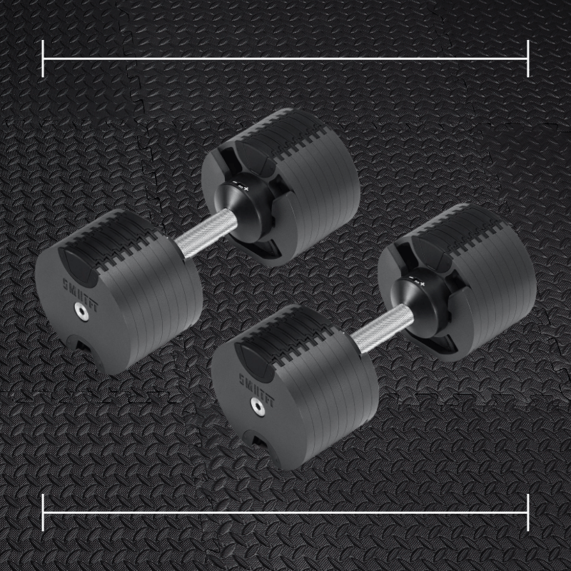 black srmtft dumbells laid over top a photo of black rubber gym flooring