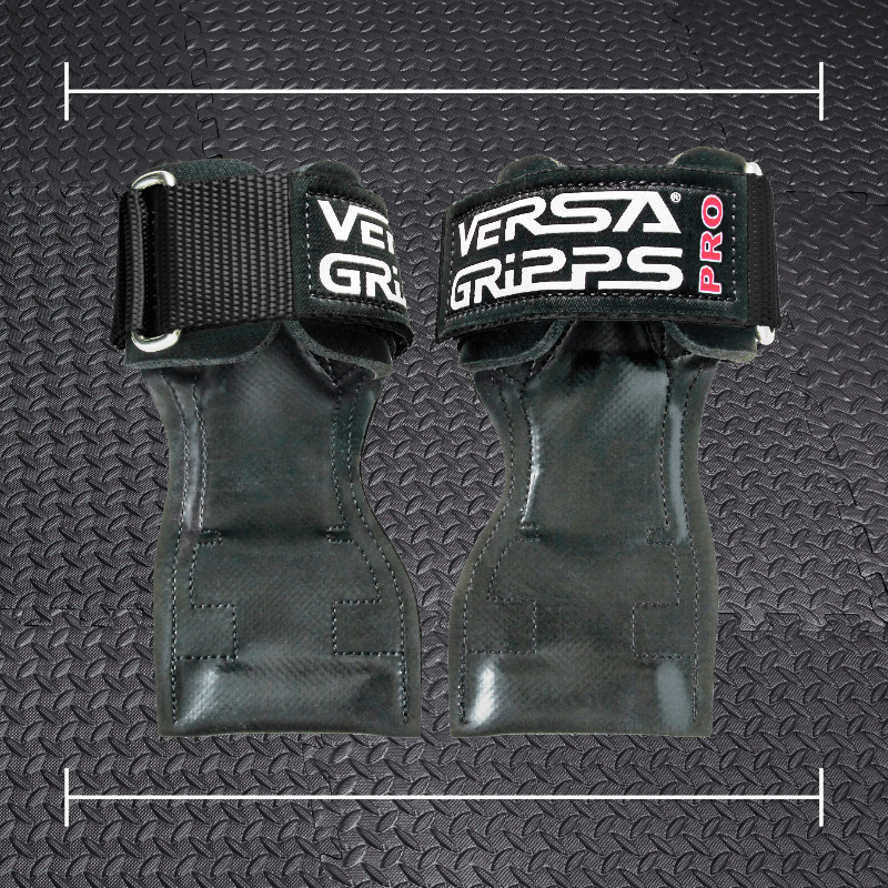black versa pro grips laid over top a photo of black rubber gym flooring